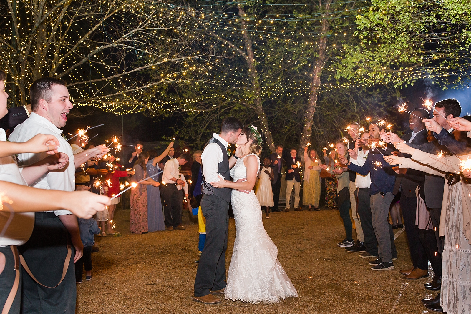 Black Fox Farms Wedding Sparkler Exit Kissing Photo