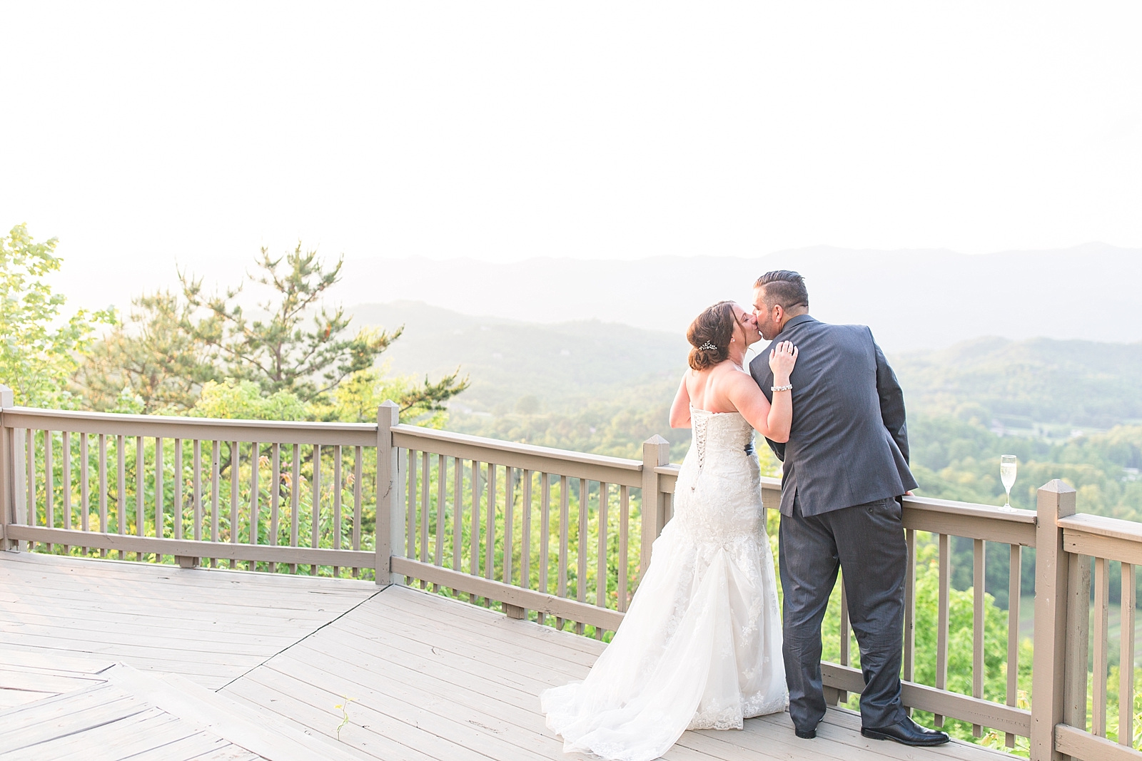 Hawkesdene Wedding Bride and Groom Kissing With View of Mountains Photo