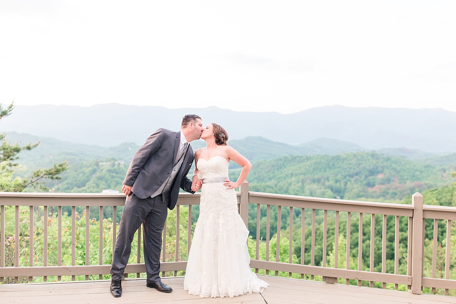 Hawkesdene Wedding Bride and Groom Kissing With View of Mountains Photo