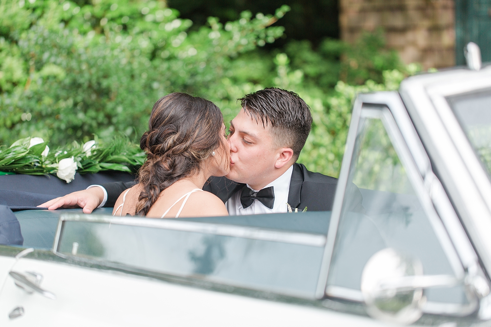 Magnolia Plantation Wedding Bride and Groom Kissing in Oldsmobile Photo
