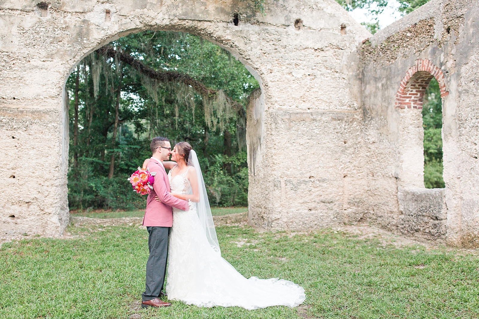 Beaufort South Carolina Wedding bride and groom kissing under chapel arch Photo