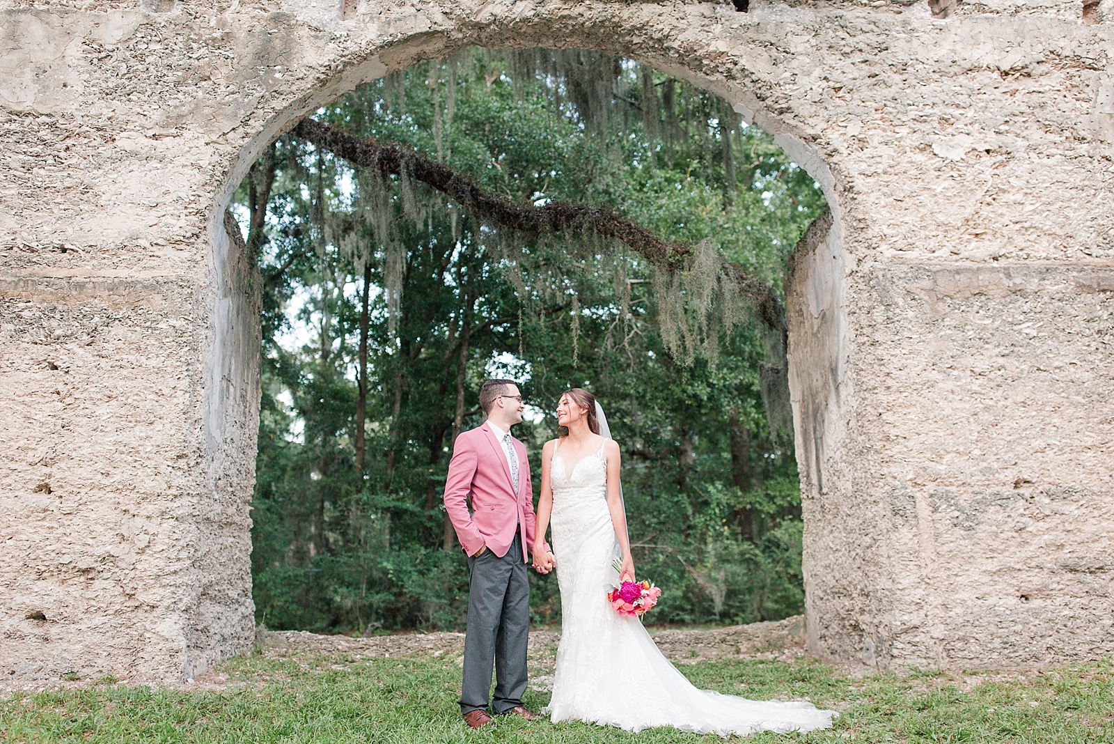 Beaufort South Carolina Wedding bride and groom holding hands under chapel arch Photo