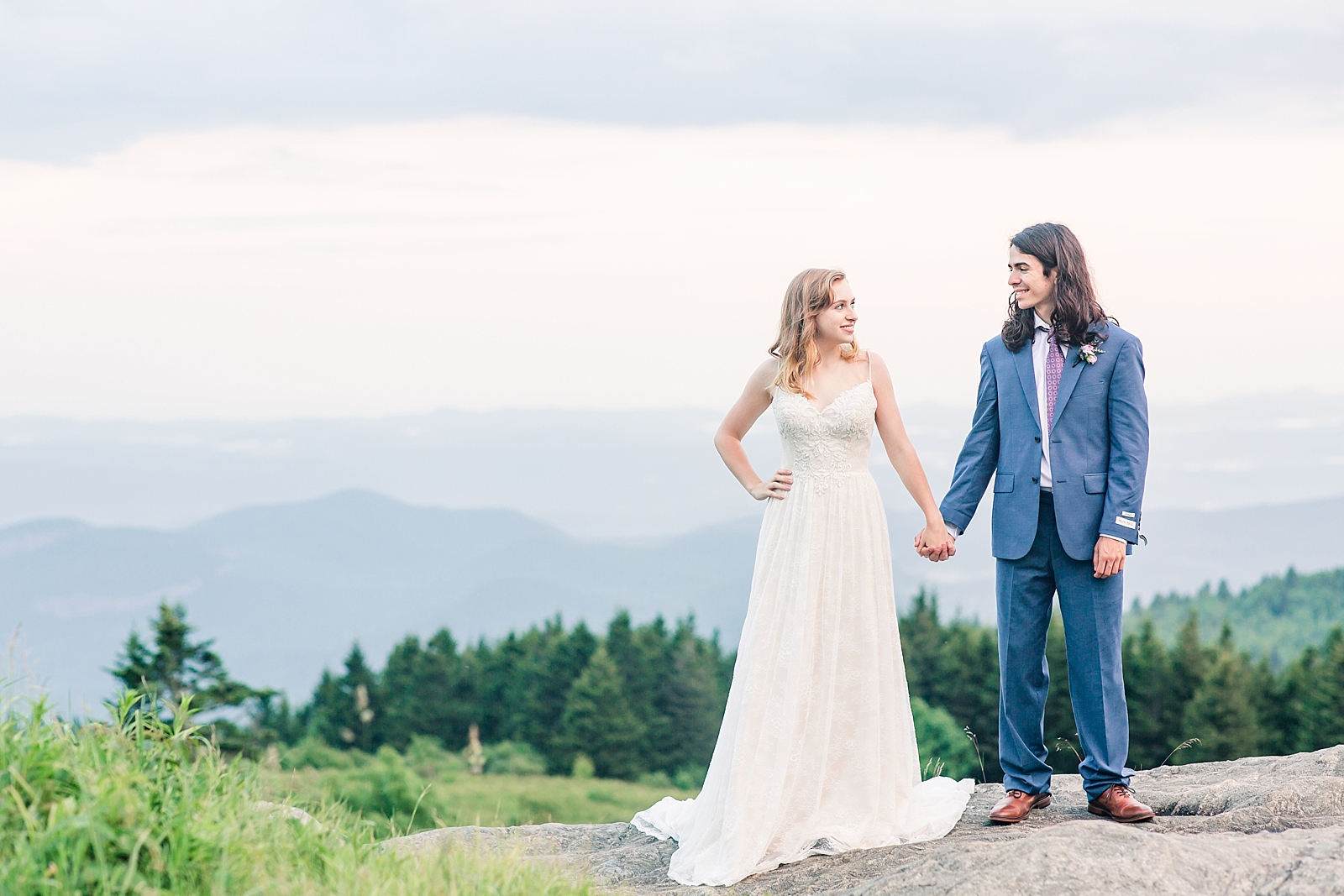 Black Balsam Knob Elopement Bride and Groom hand and hand with mountain backdrop Photo