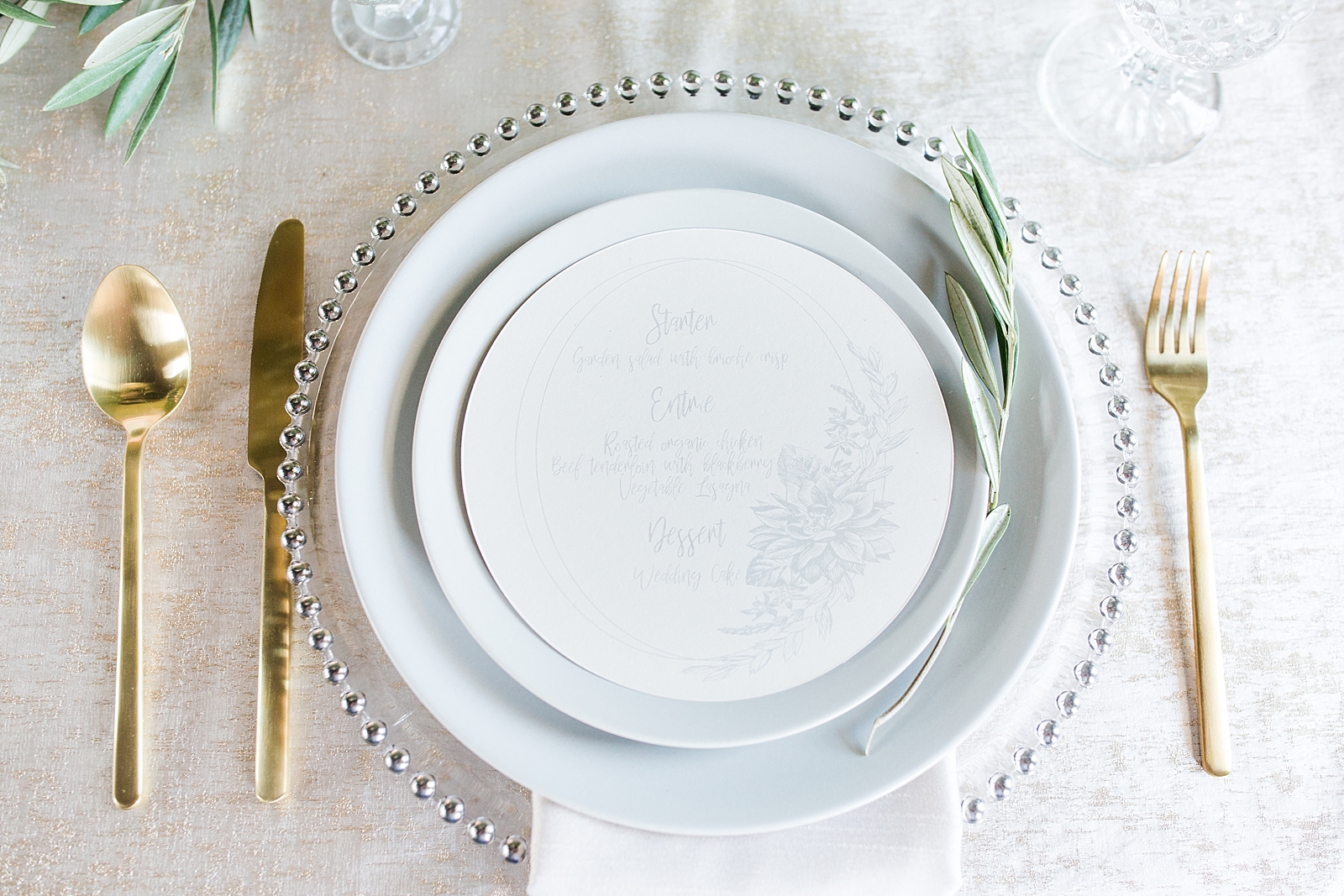 Atlanta Georgia Wedding reception place setting with grey plates and gold utensils Photo