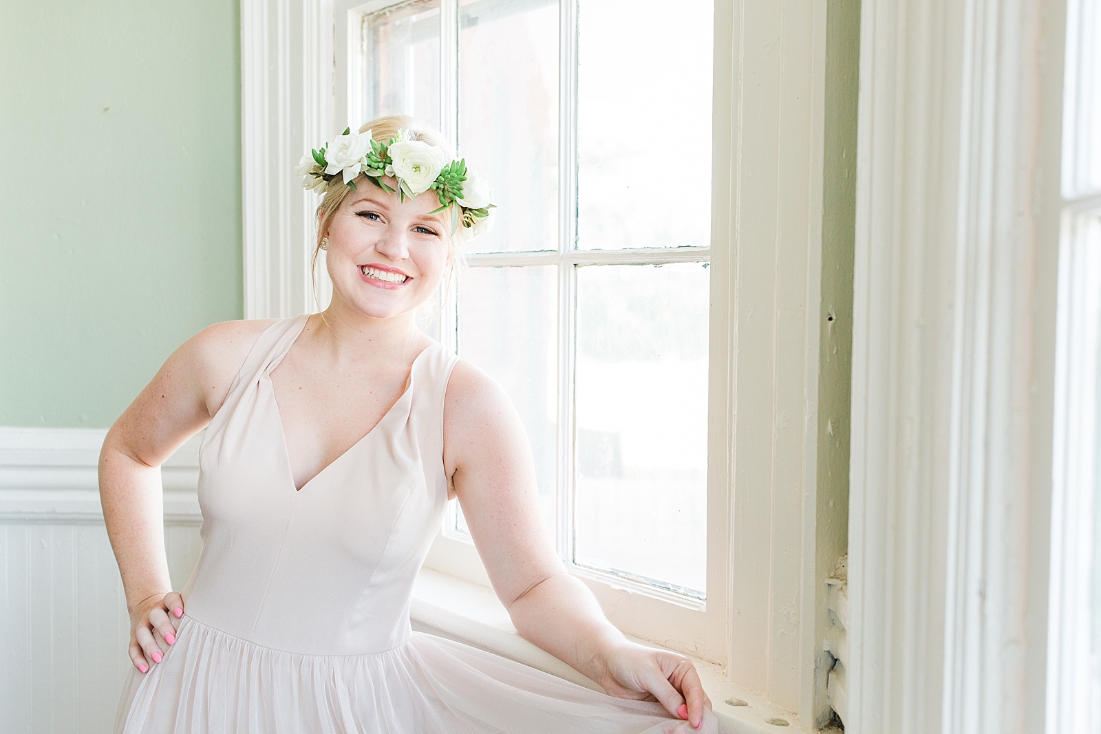 Atlanta Georgia Wedding bridesmaid by window wearing flower crown Photo