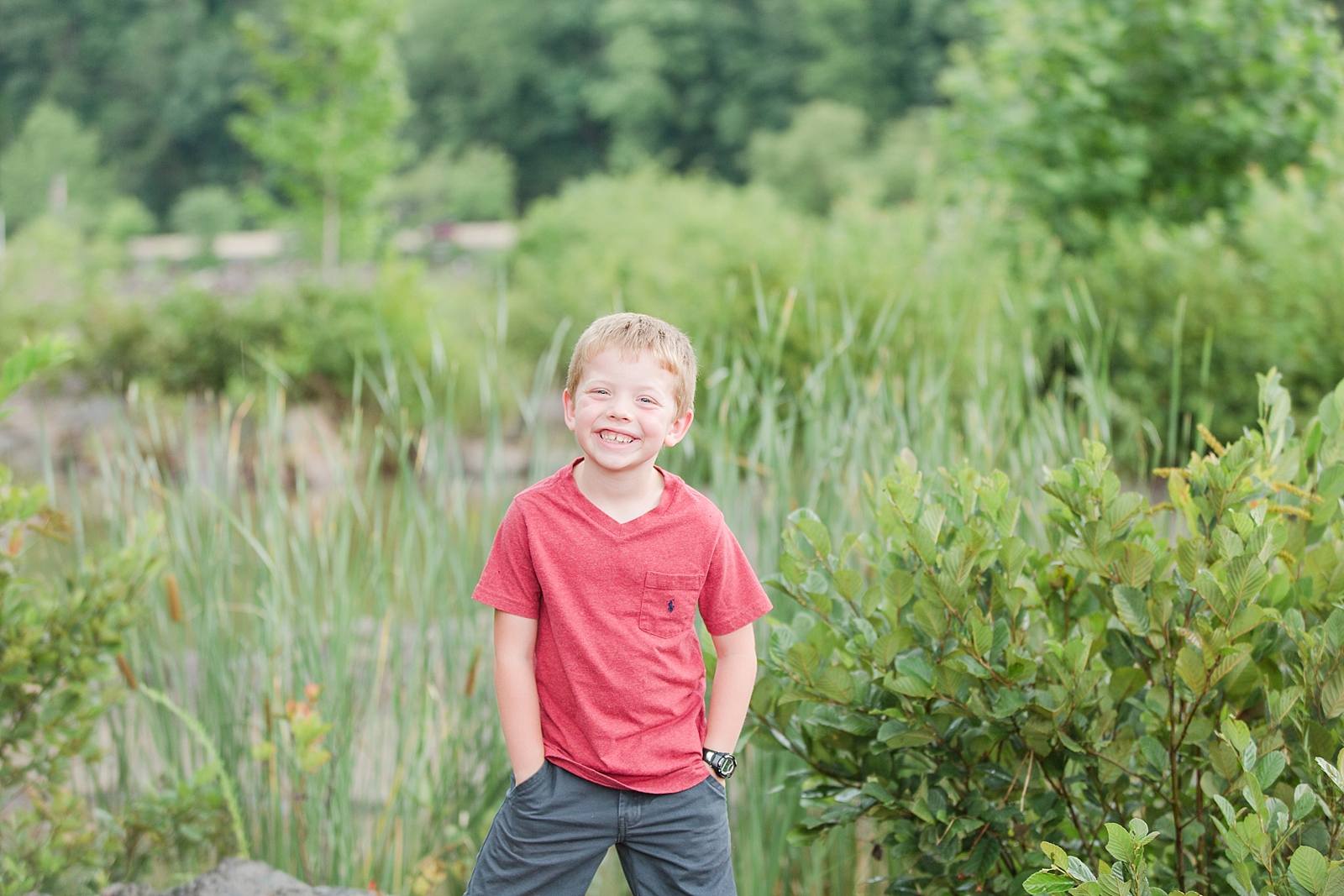 Little boy in front of rocks and weeds at the Ocoee River Photo