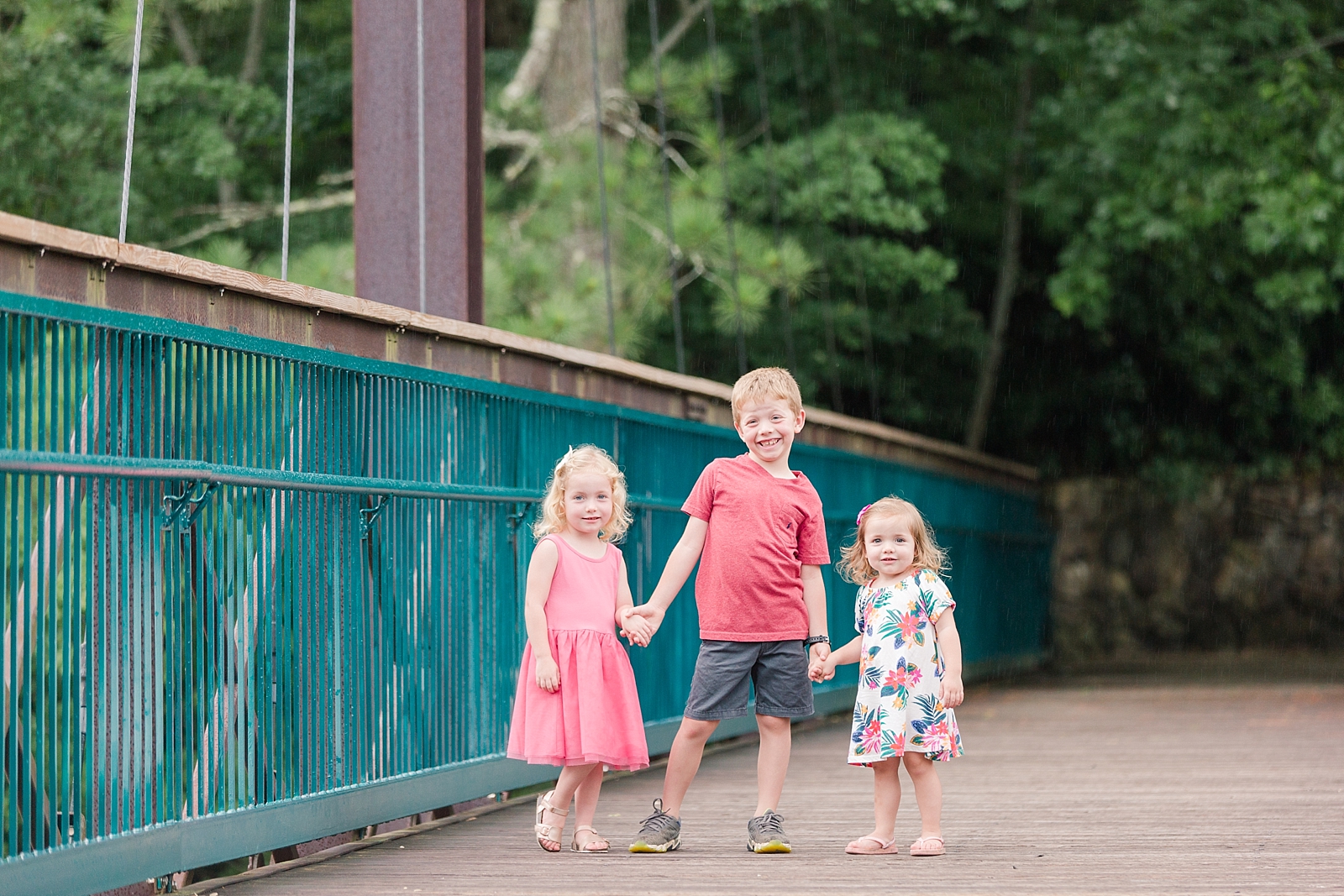 three kids on bridge holding hands at the Ocoee River Photo