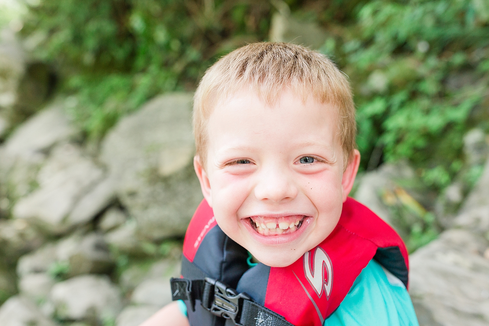 Nantahala River little boy in life jacket smiling big photo