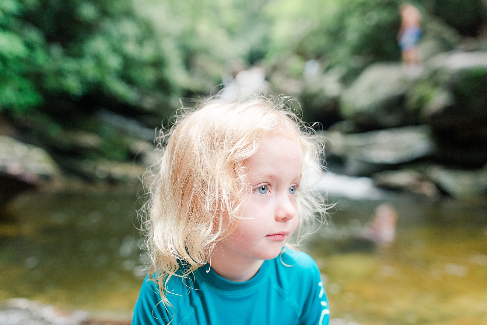 Skinny Dip Falls Blue eyed little girl with blonde hair looking off Photo