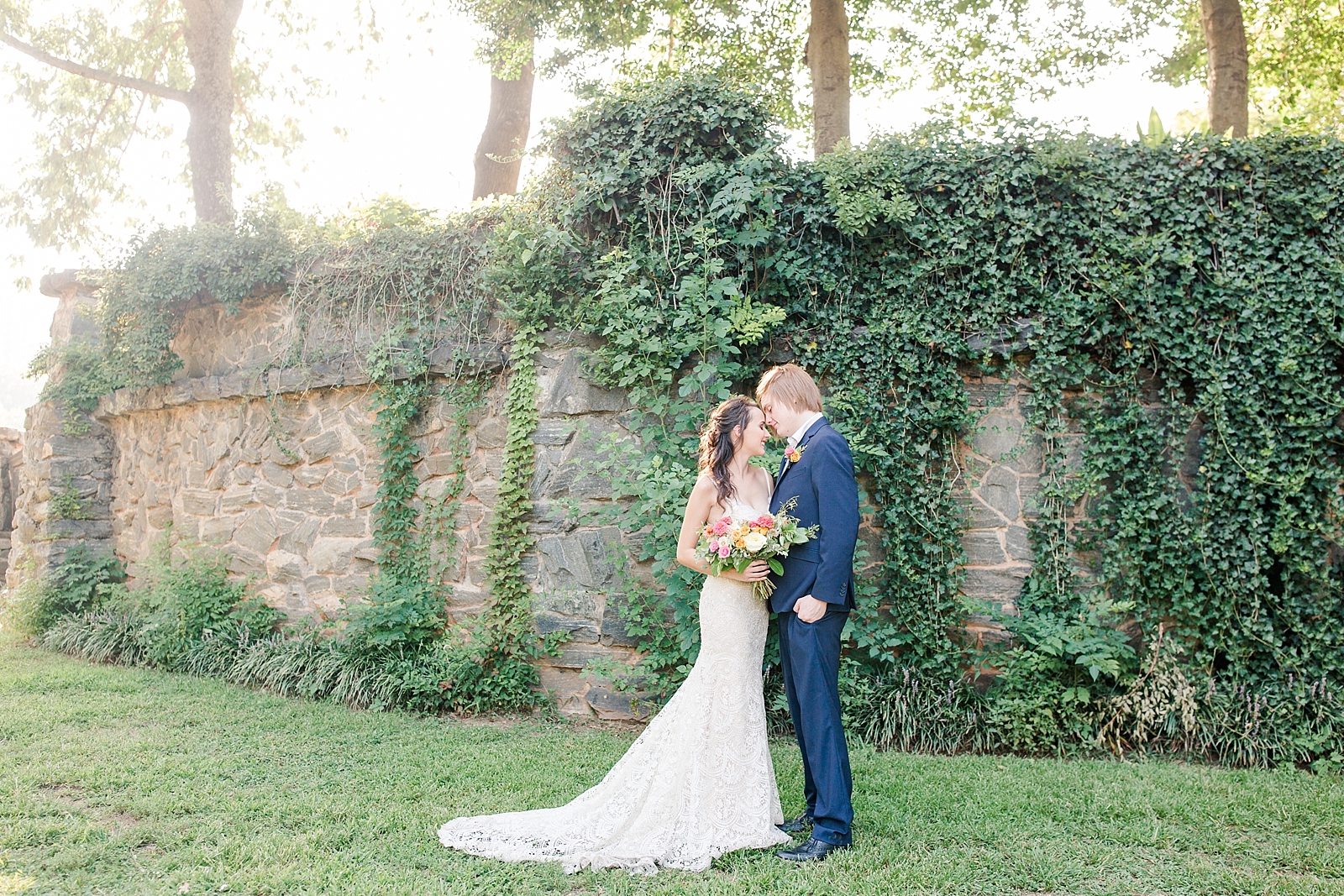 Atlanta Georgia Elopement Bride and Groom nose to nose in front of a stack stone wall of ivy Photo