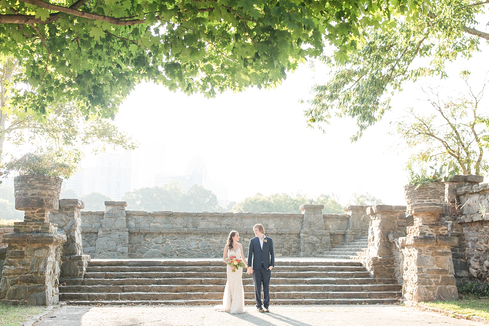 Atlanta Georgia Elopement Bride and Groom walking toward camera with stack stone stairway in background Photo