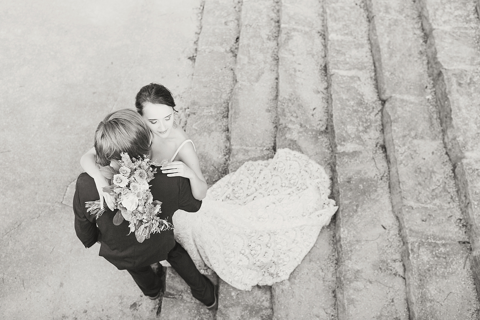 Atlanta Georgia Elopement Black and White of Bride and Groom hugging on stone staircase Photo