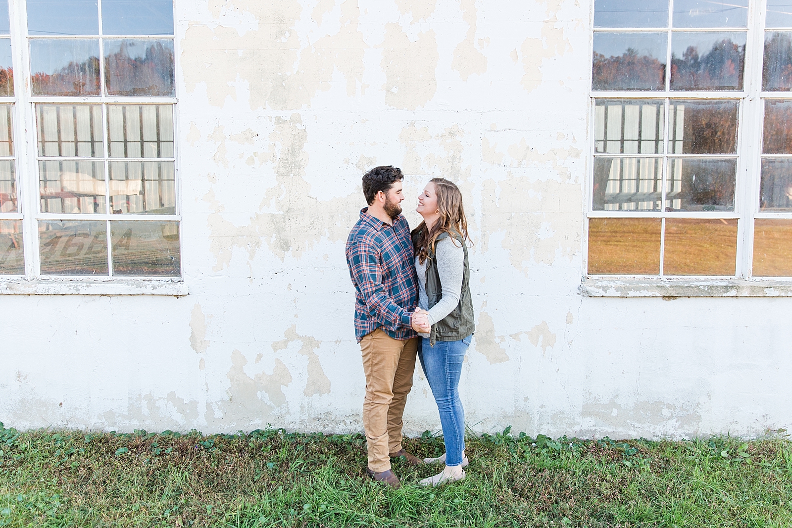 North Carolina Mountains Engagement Couple smiling at each other Photo
