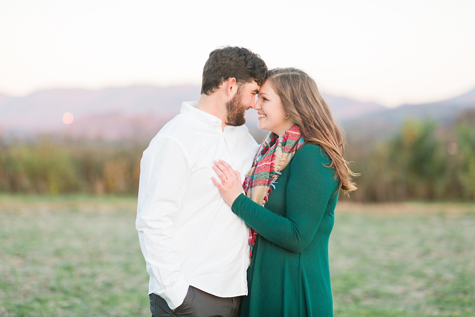 North Carolina Mountains Engagement Couple Nose to Nose with mountains in background Photo