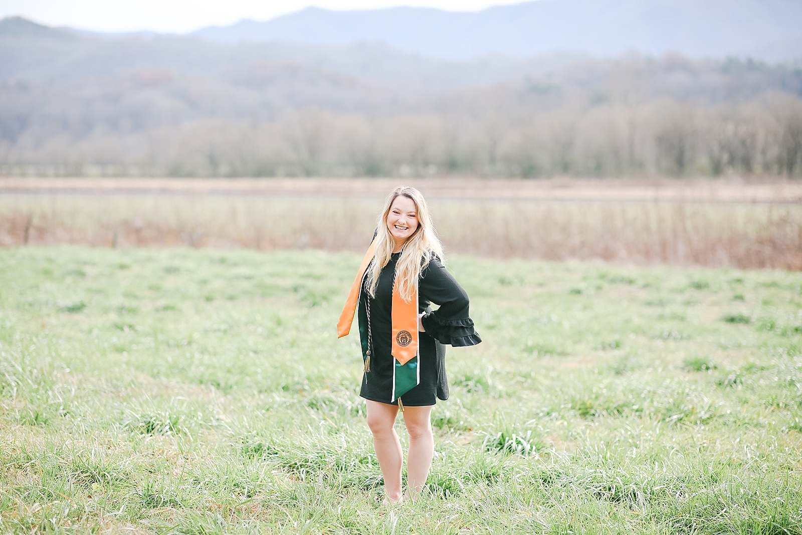 Kennesaw State University Senior Session Rachel in field smiling at camera photo