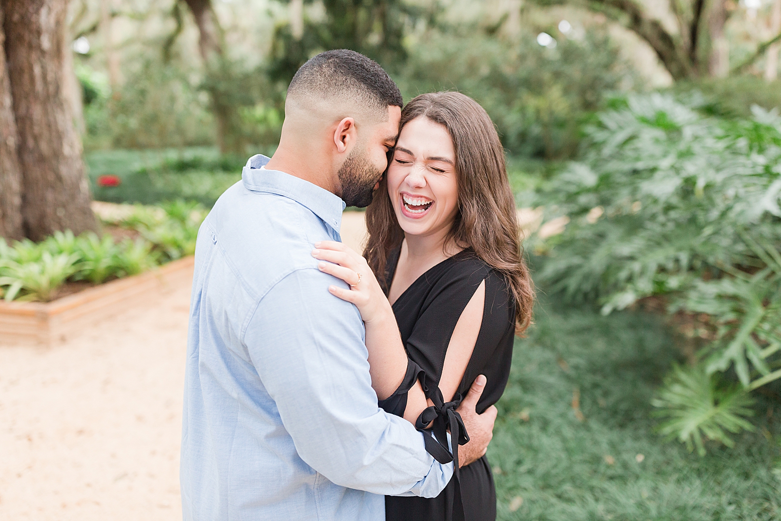 St. Augustine Engagement Couple snuggling and Chloe laughing Photo