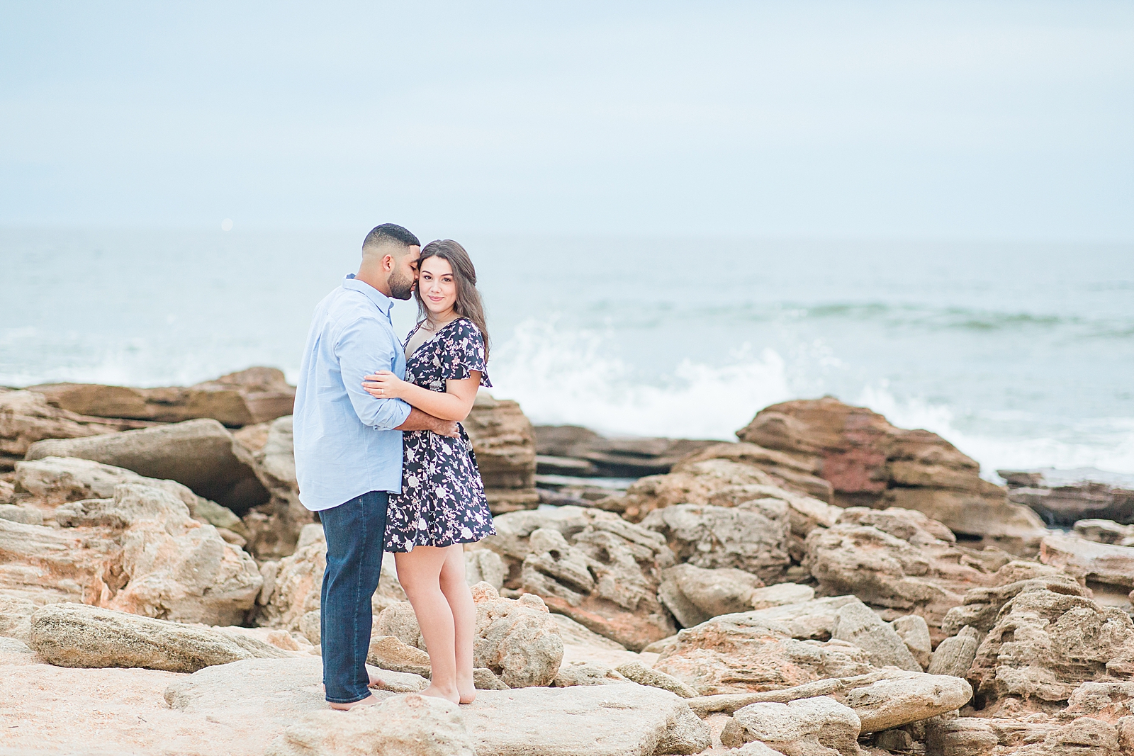 St. Augustine Engagement Couple on Rocks at the beach Photo