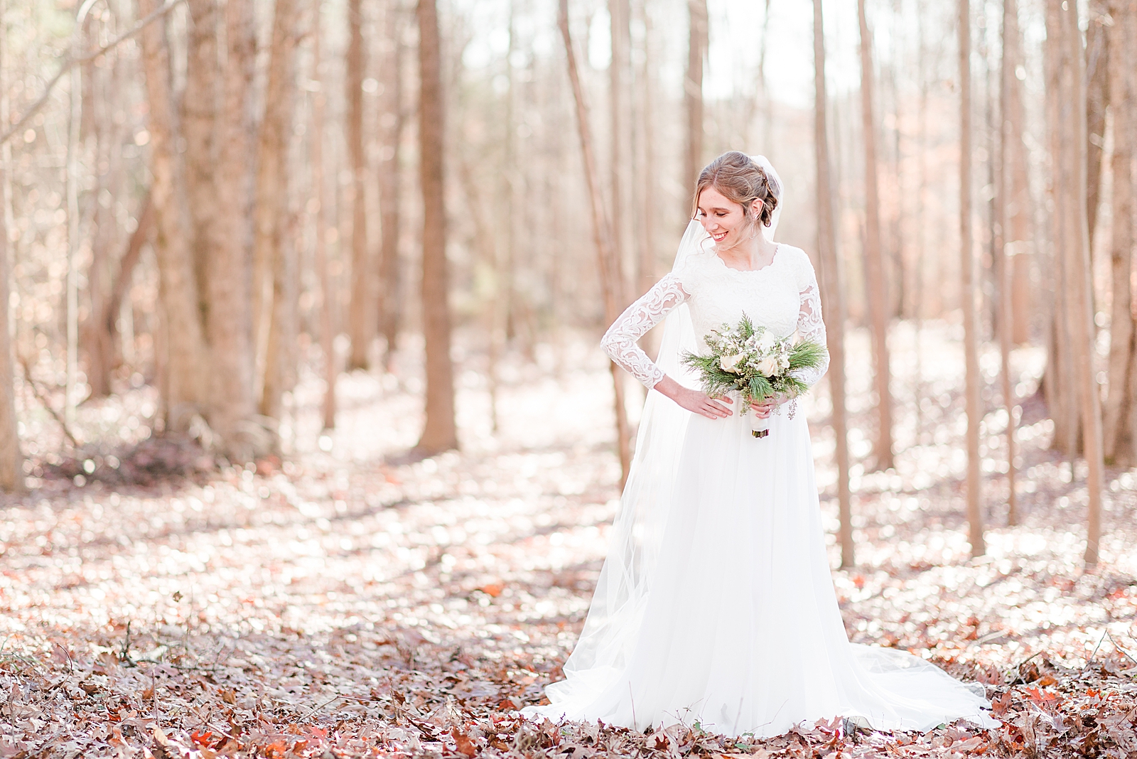 Charlotte Bridal Session Annabel looking down over her shoulder in the woods Photo