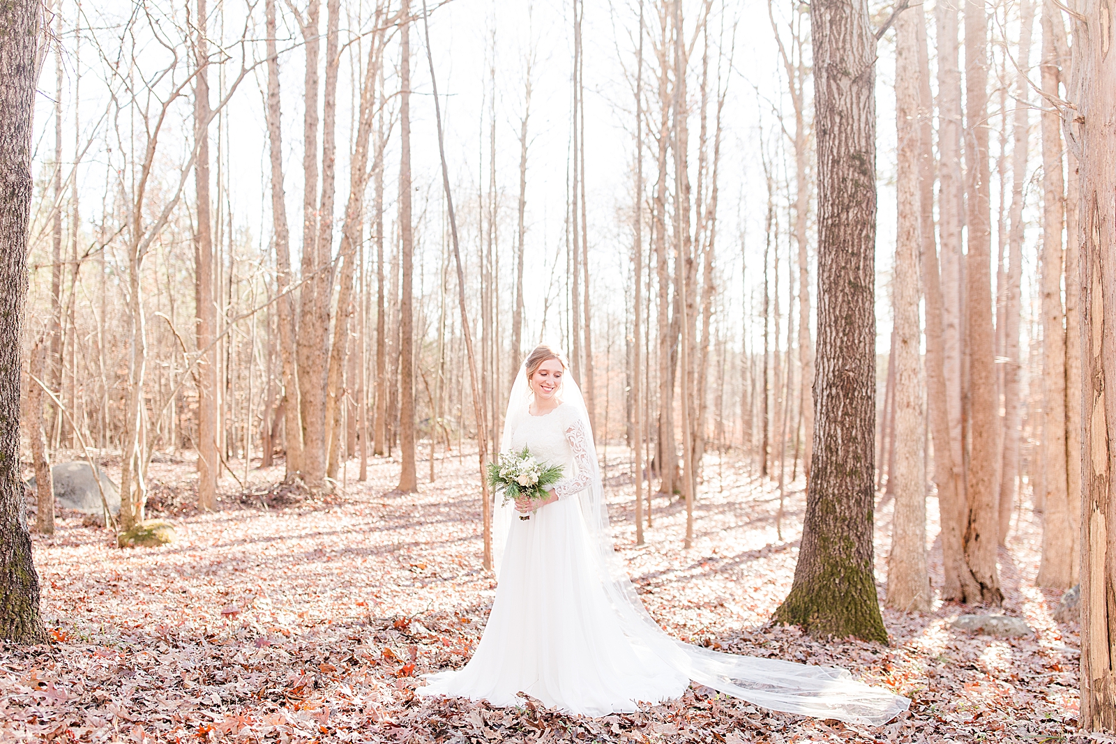 Charlotte Bridal Session Annabel smiling over her shoulder in the woods Photo