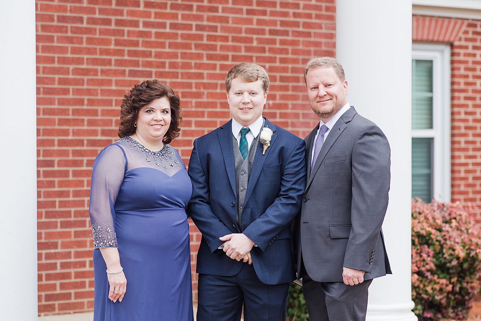 Charlotte Wedding Groom with parents smiling at the camera Photo