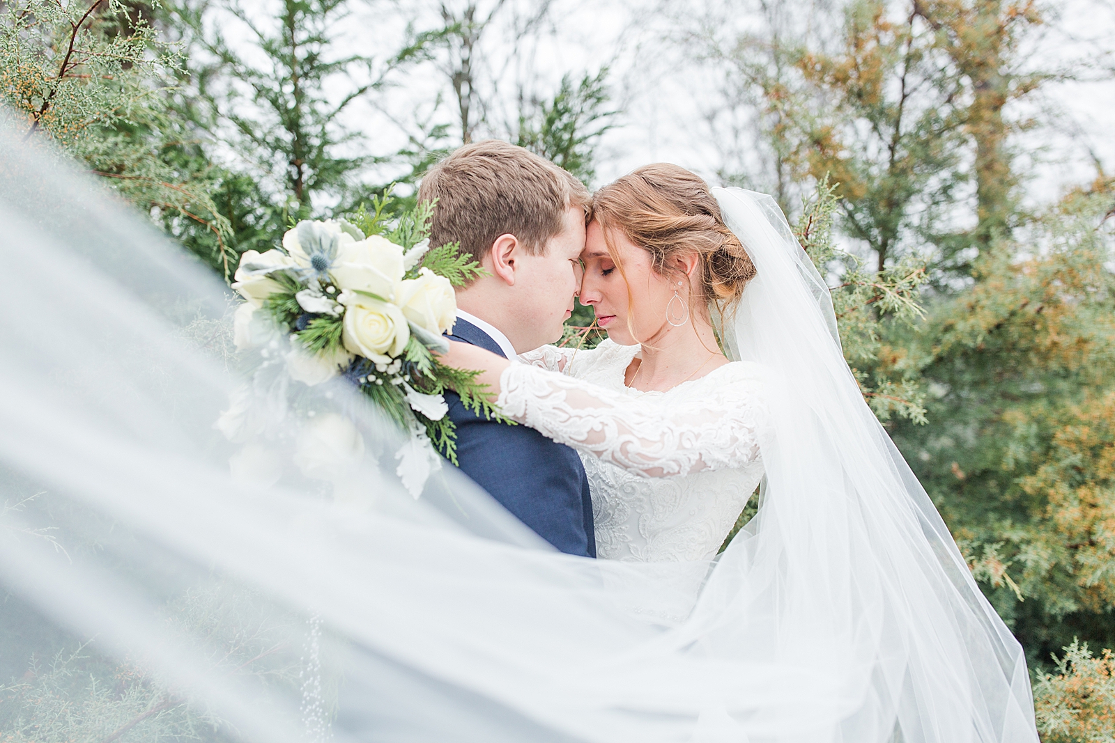 Charlotte Wedding Bride and Groom heads together and eyes closed with Veil sweeping in front Photo