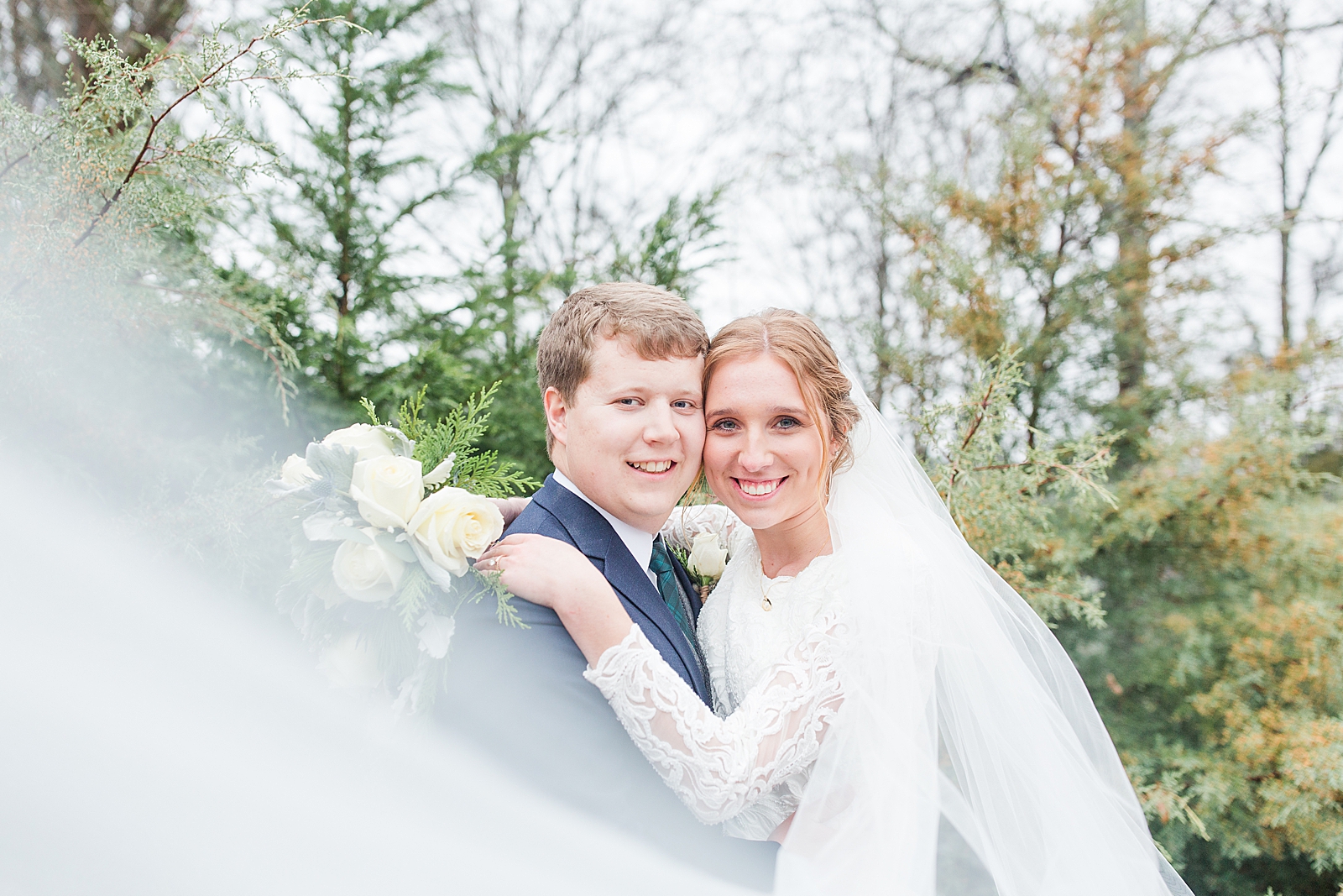 Charlotte Wedding Bride and Groom Smiling at camera with veil sweeping in front Photo