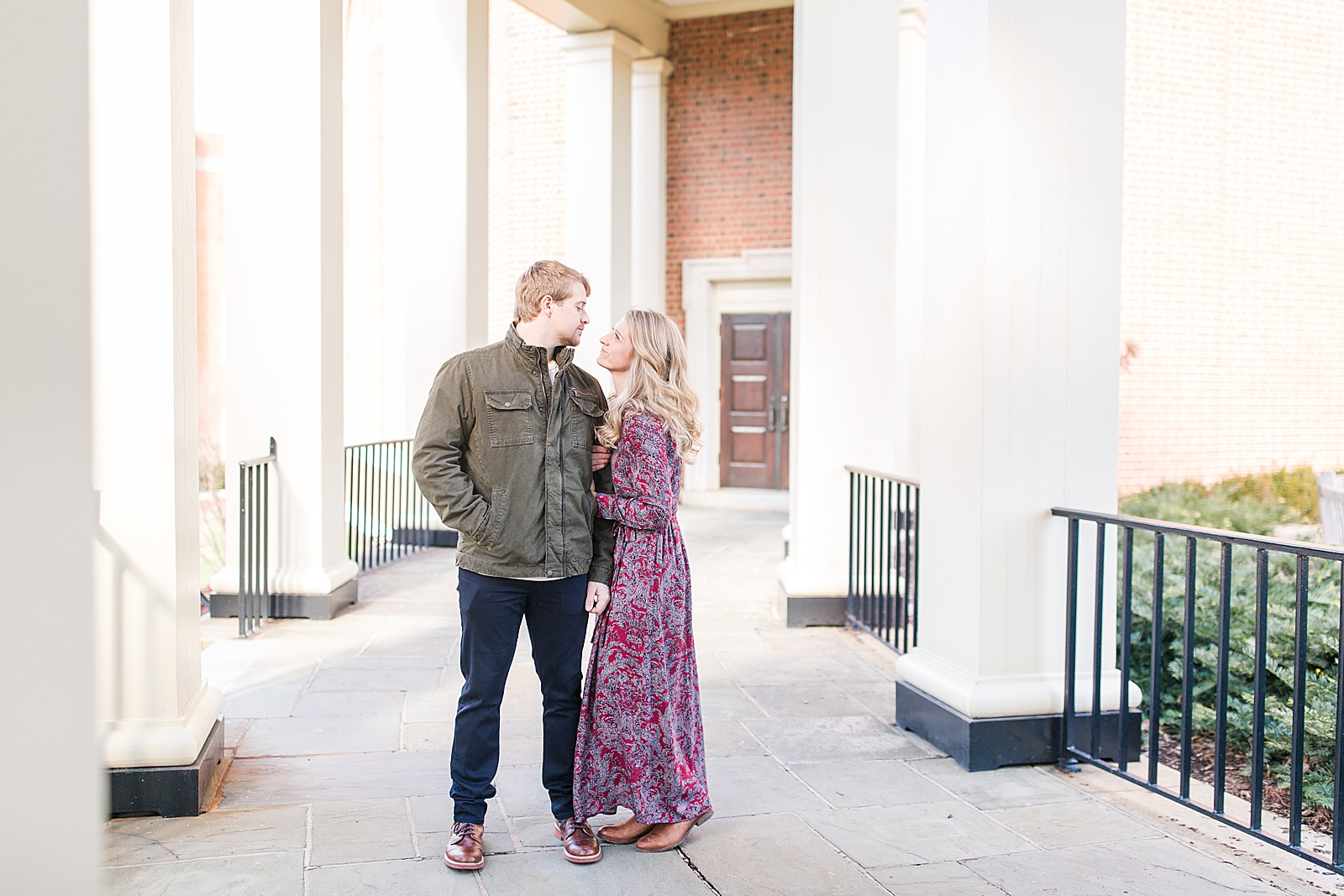 Winston-Salem Engagement Session couple looking at each other in hallway Photo