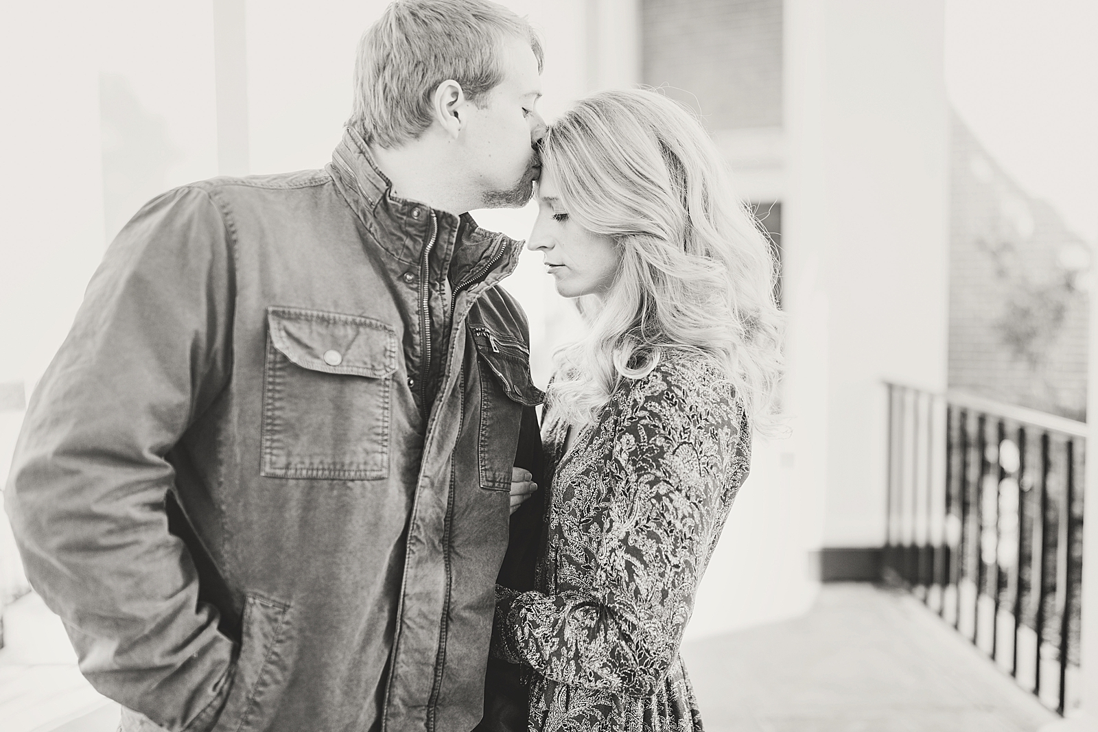 Winston-Salem Engagement Session Black and white of Chris kissing Katie on the head Photo