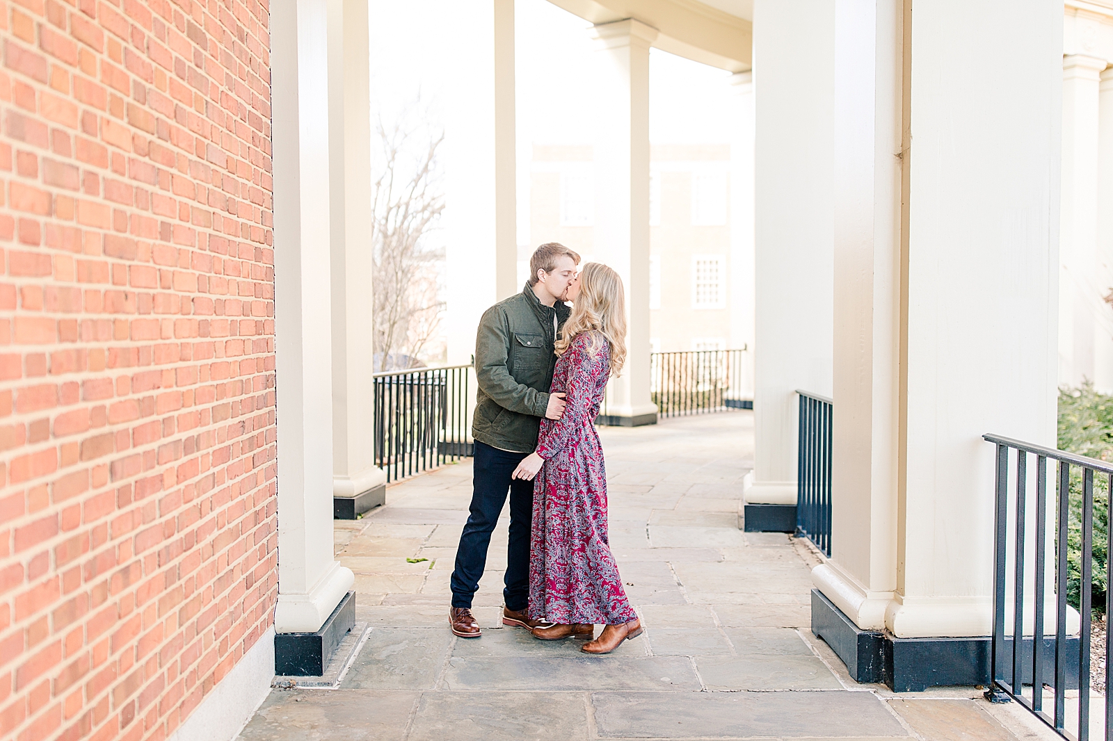 Winston-Salem Engagement Session Couple kissing in hallway Photo