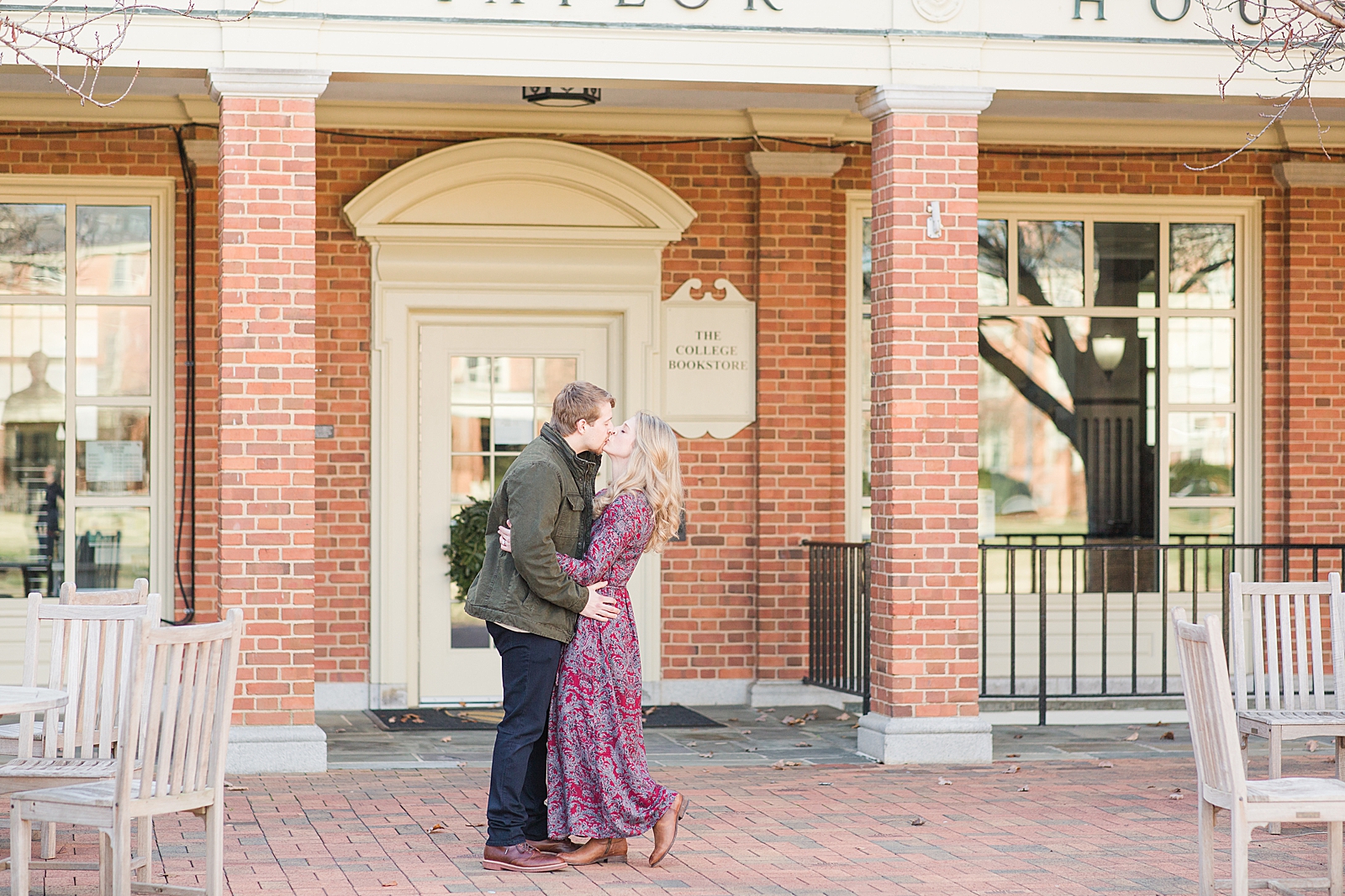 Winston-Salem Engagement Session couple kissing in front of the Wake Forest University book store Photo