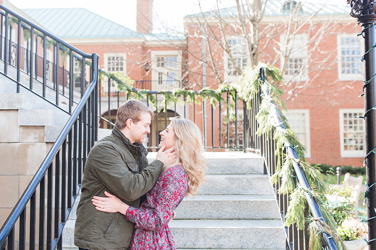 Winston-Salem Engagement Session Couple smiling at each other on stairs Photo