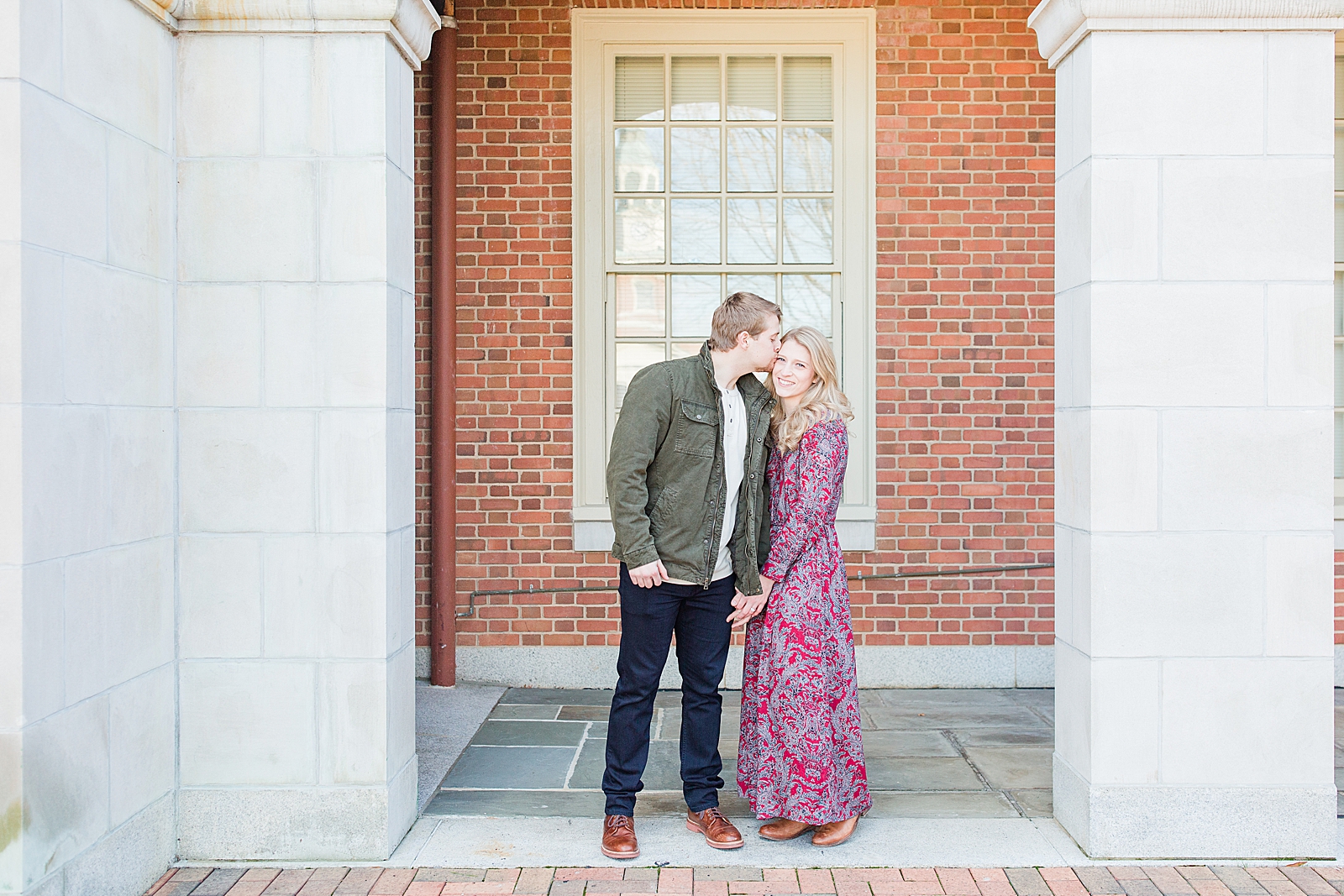 Winston-Salem Engagement Session Chris kissing Katie on forehead under arch Photo