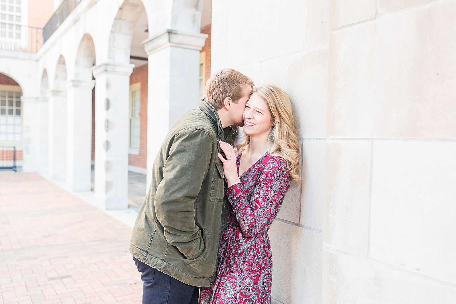Winston-Salem Engagement Session Couple leaning against wall Katie laughing Photo