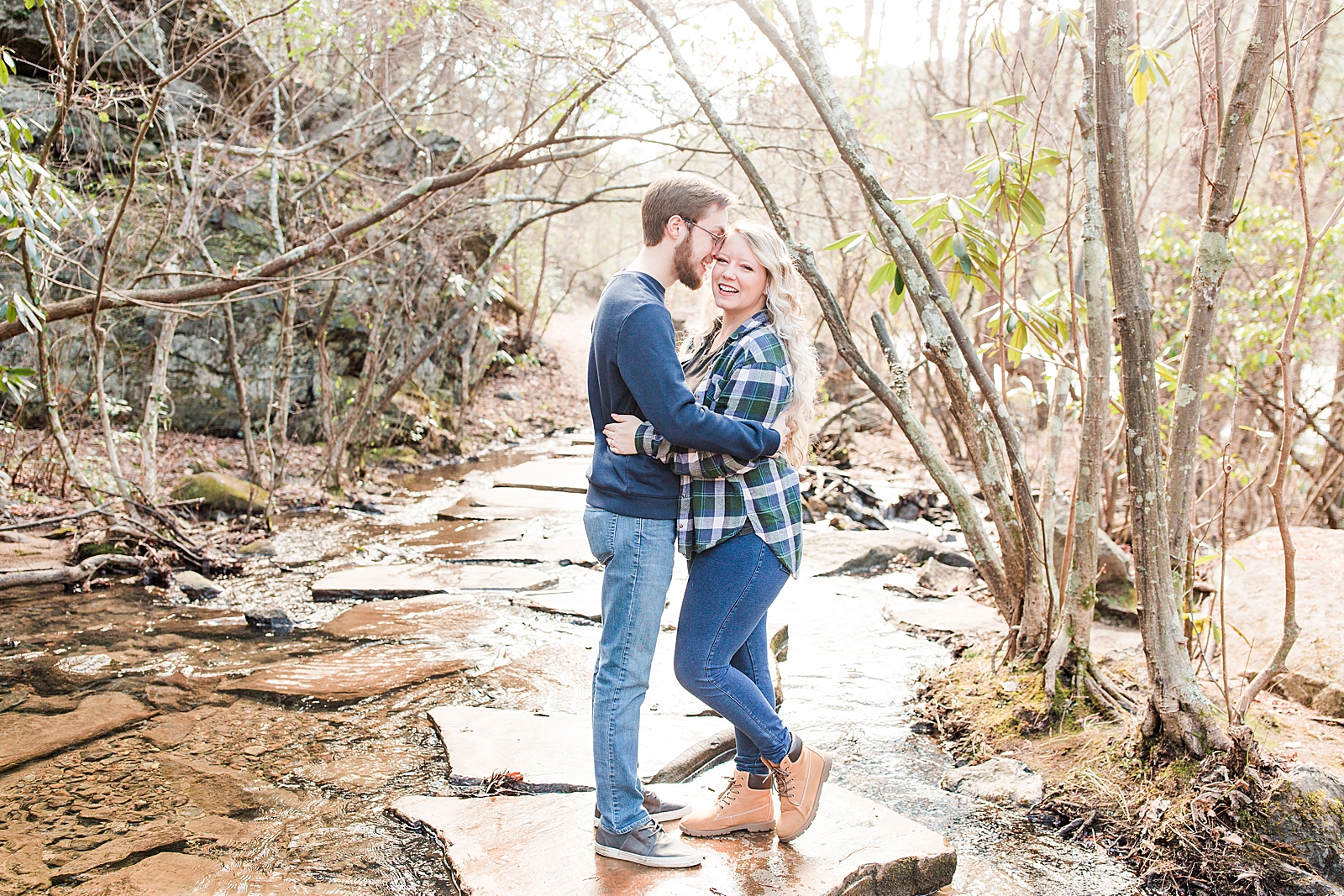 Ocoee River Engagement Session Haley Smiling at Camera and Cody nuzzling in Photo