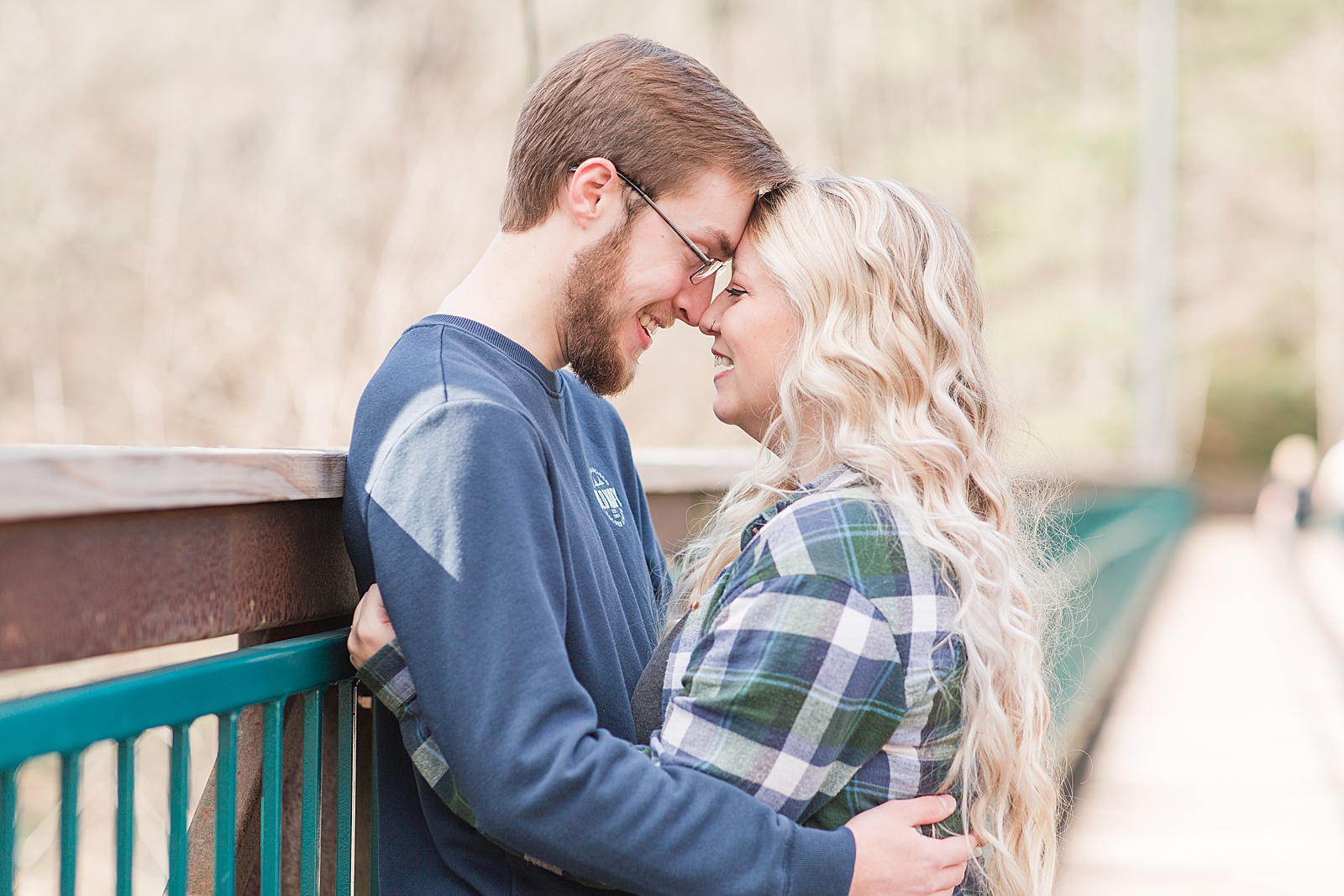 Ocoee River Engagement Session Cody and Haley nose to nose on bridge Photo
