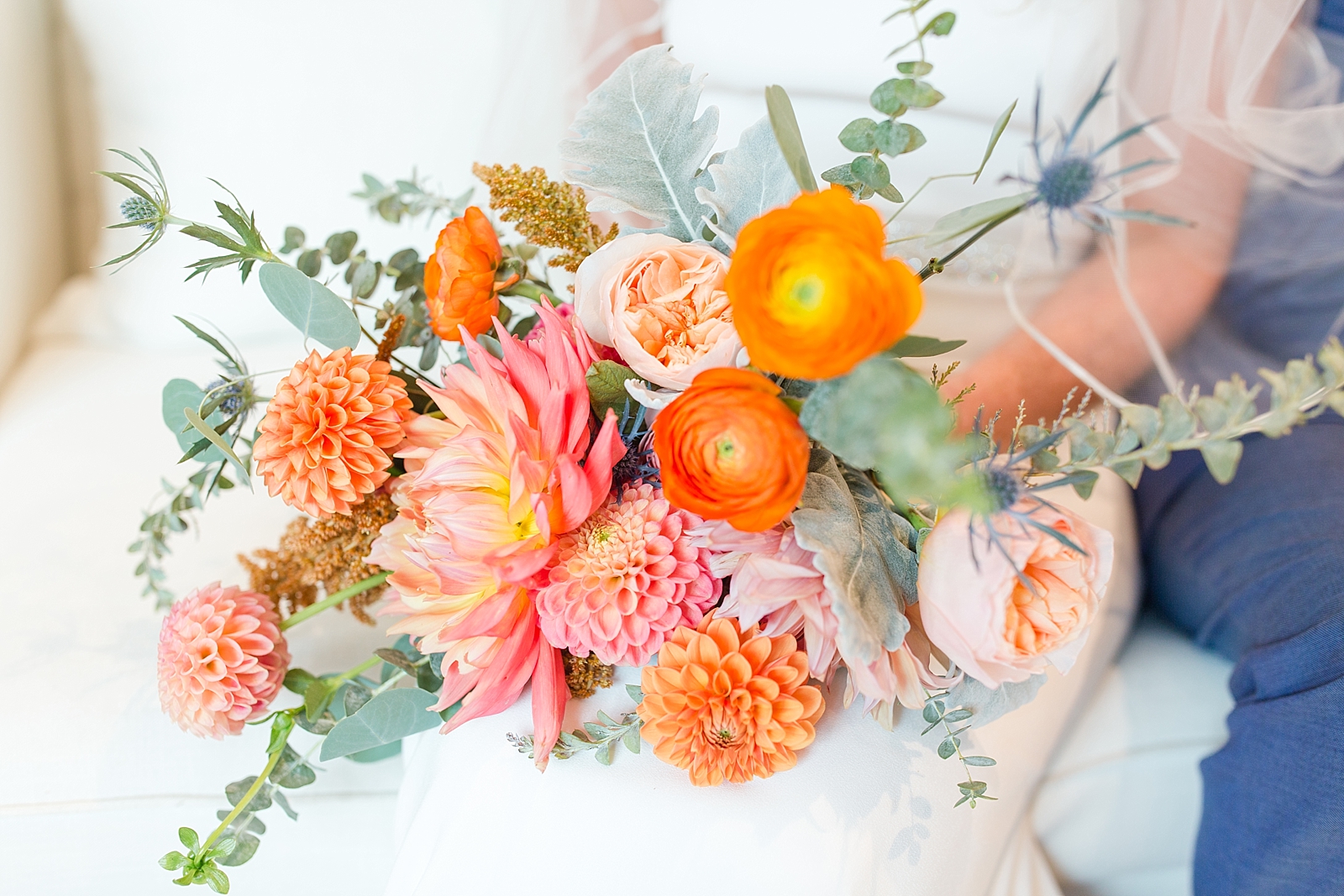 Chestnut Ridge Wedding orange and pink bridal bouquet on brides lap Photo