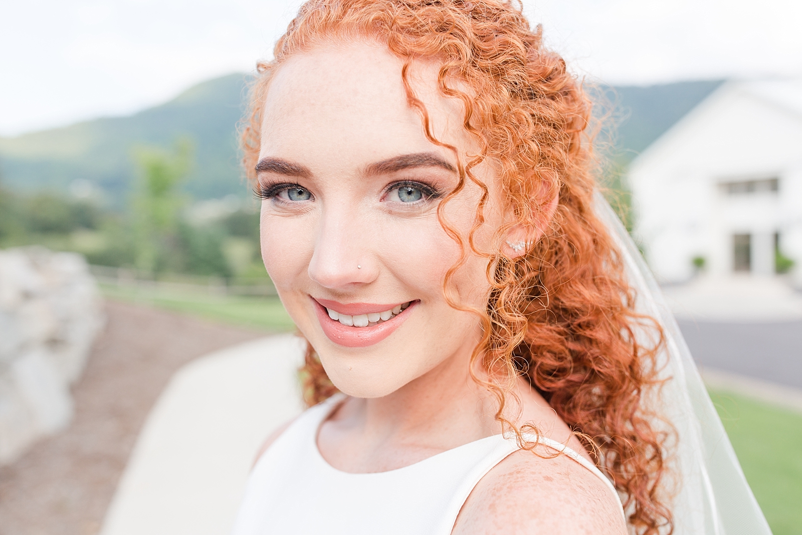 Chestnut Ridge Wedding bridal portrait of Carli with red curly hair and blue eyes Photo
