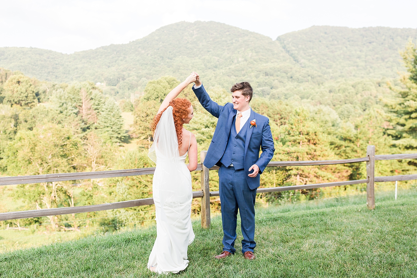 Chestnut Ridge Wedding groom spinning bride with mountain background Photo