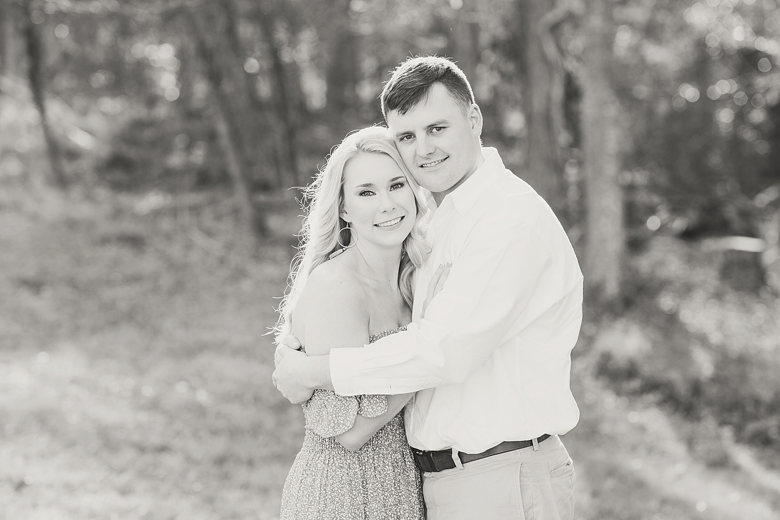 Kennesaw Mountain Engagement Session Black and white of couple hugging smiling at camera Photo