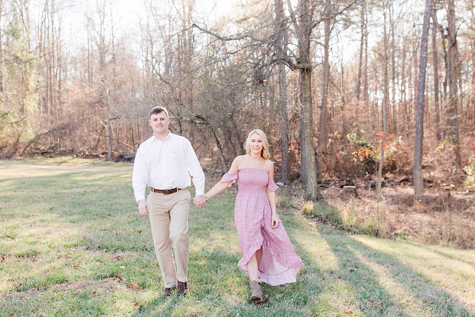 Kennesaw Mountain Engagement Session Couple holding hands walking toward the camera Photo