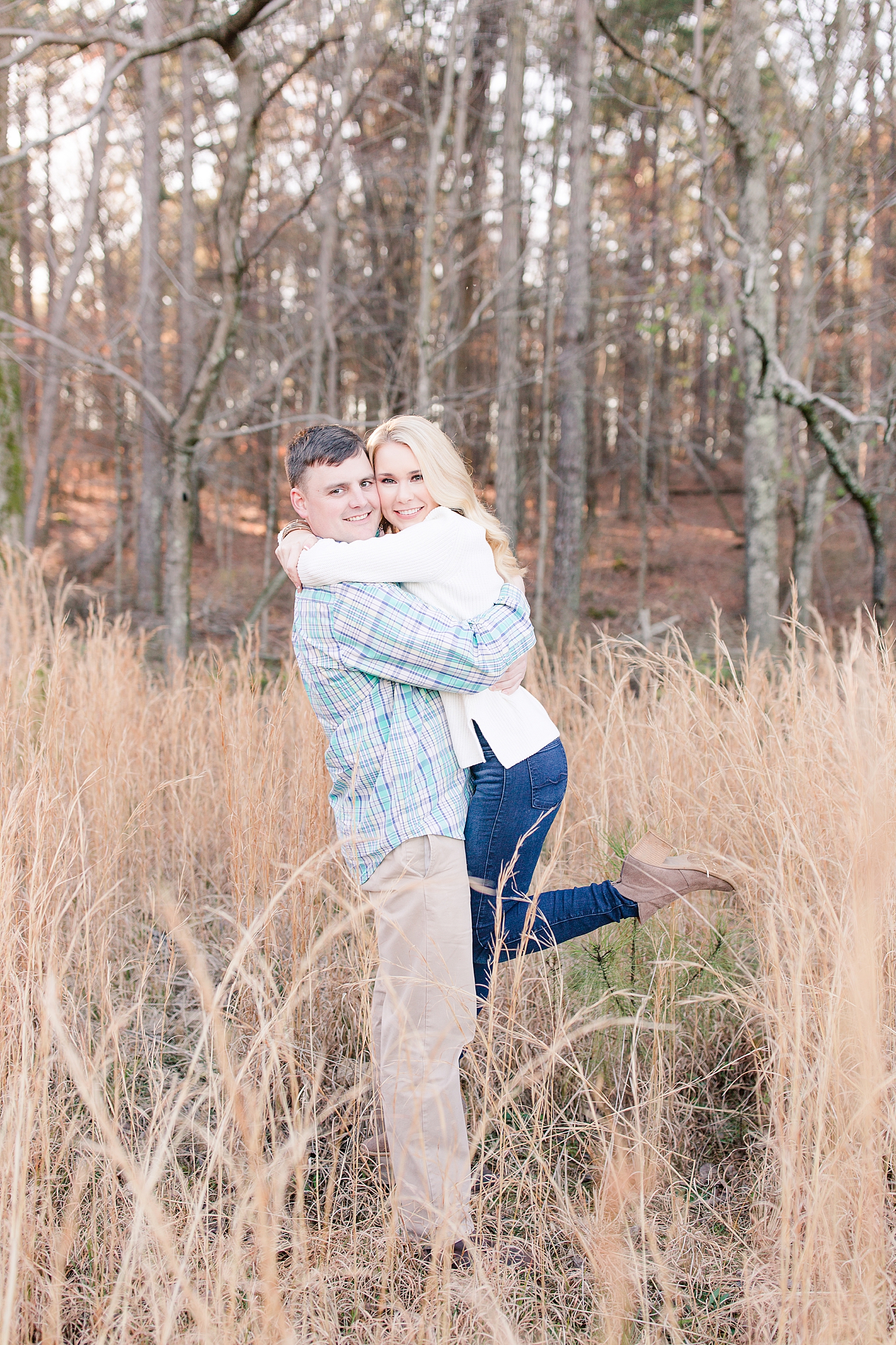 Kennesaw Mountain Engagement Session Michael picking Sarah up smiling at the camera Photo