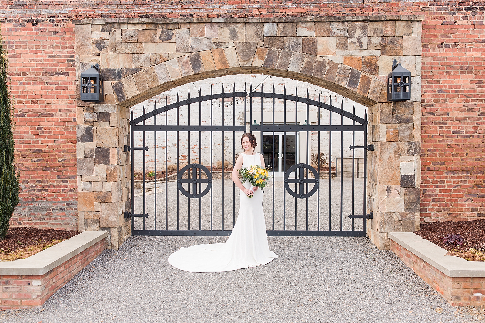 Hackney Warehouse Spring Bridal Session Bride in front of iron gates Photo