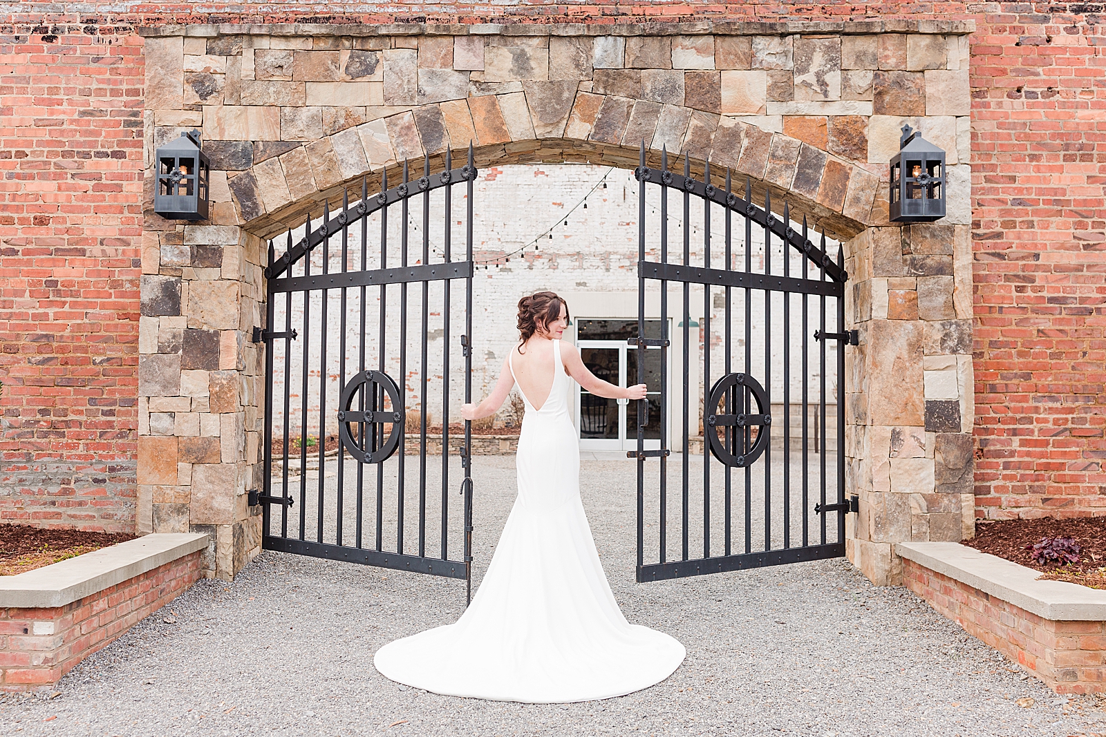 Hackney Warehouse Spring Bridal Session Bride in front of iron gates Photo