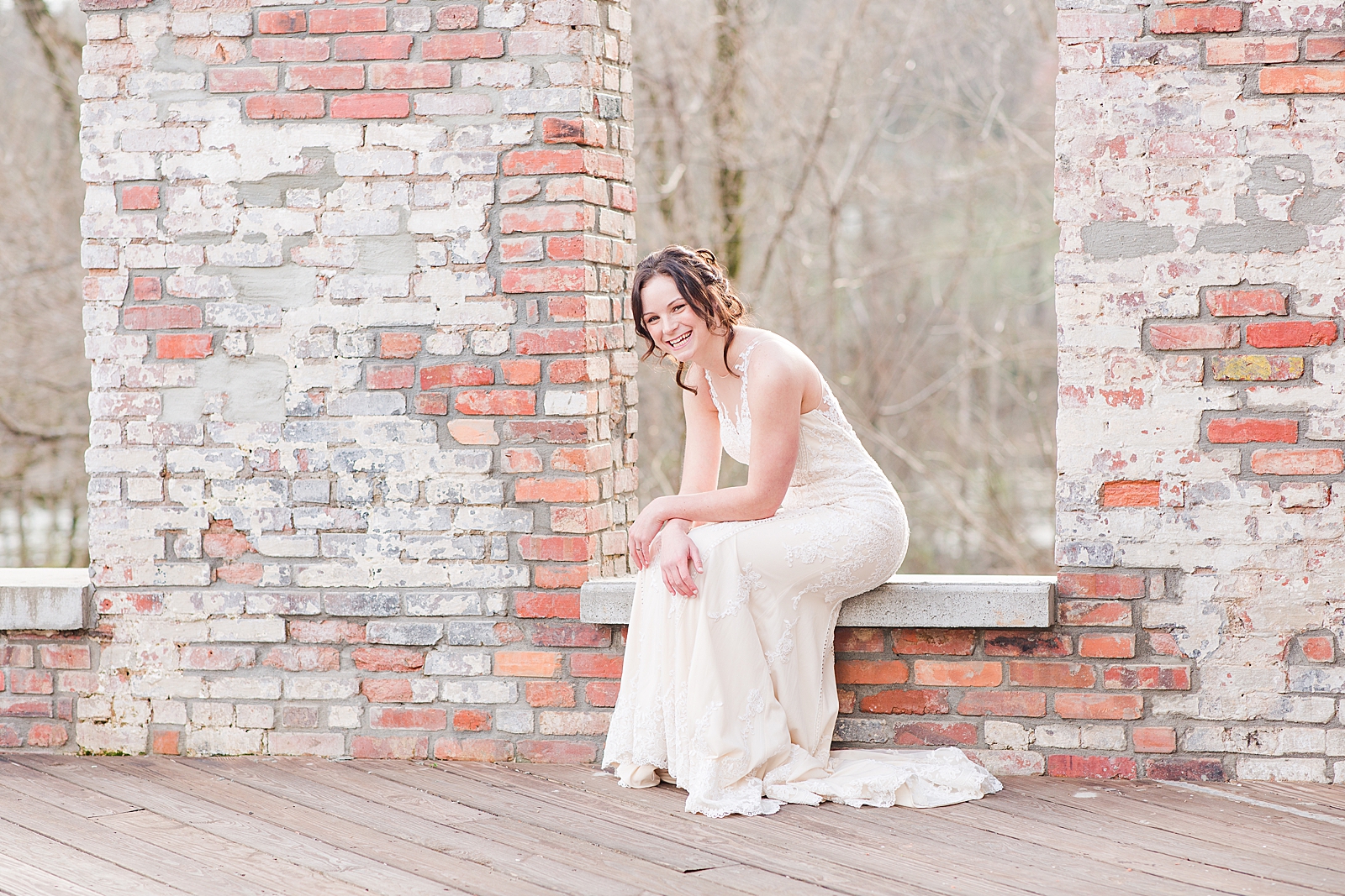 Hackney Warehouse Spring Bridal Session Bride sitting in window laughing Photo