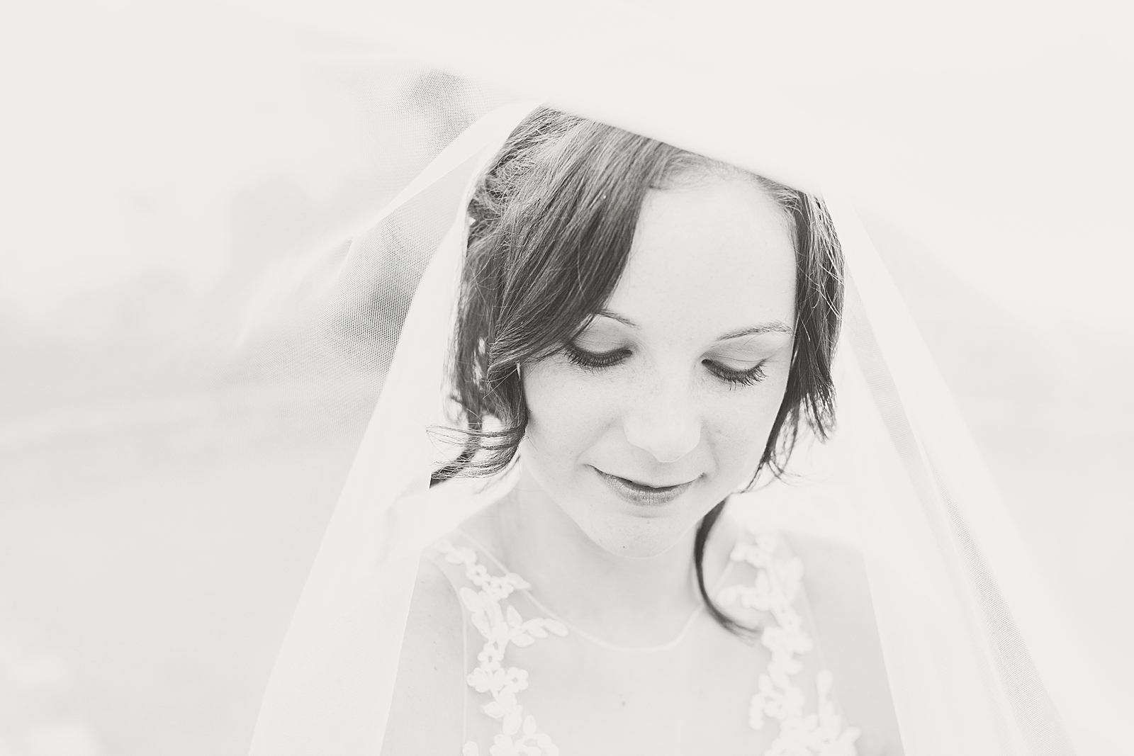 Hackney Warehouse Spring Bridal Session Black and white of bride looking down under the veil Photo