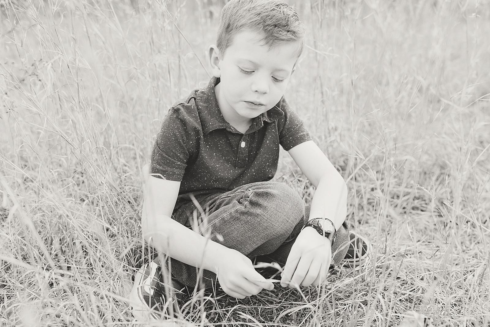 Asheville Photographer's Family Black and White of little boy playing in tall grass Photo