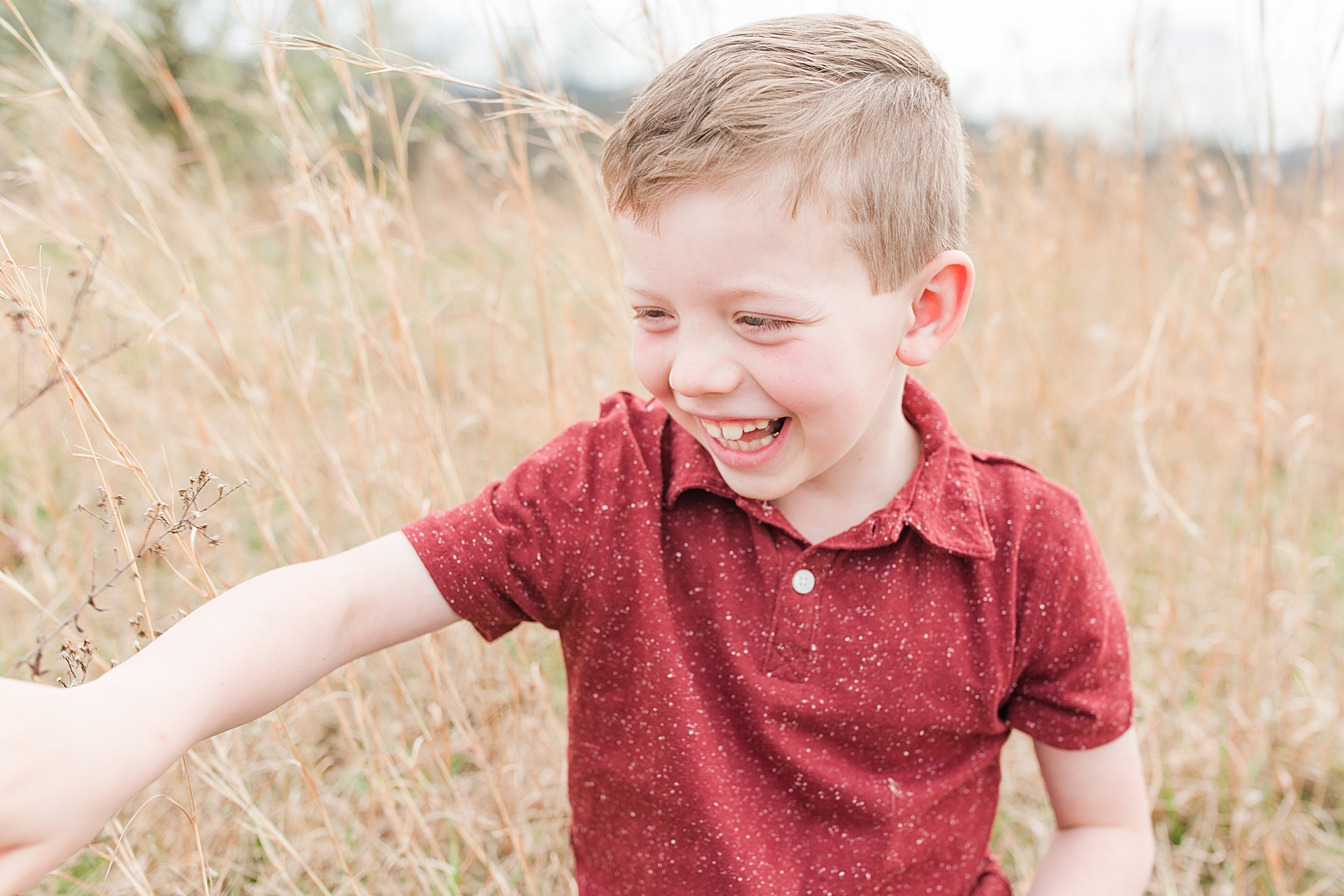 Asheville Photographer's Family Little boy in red shirt laughing Photo