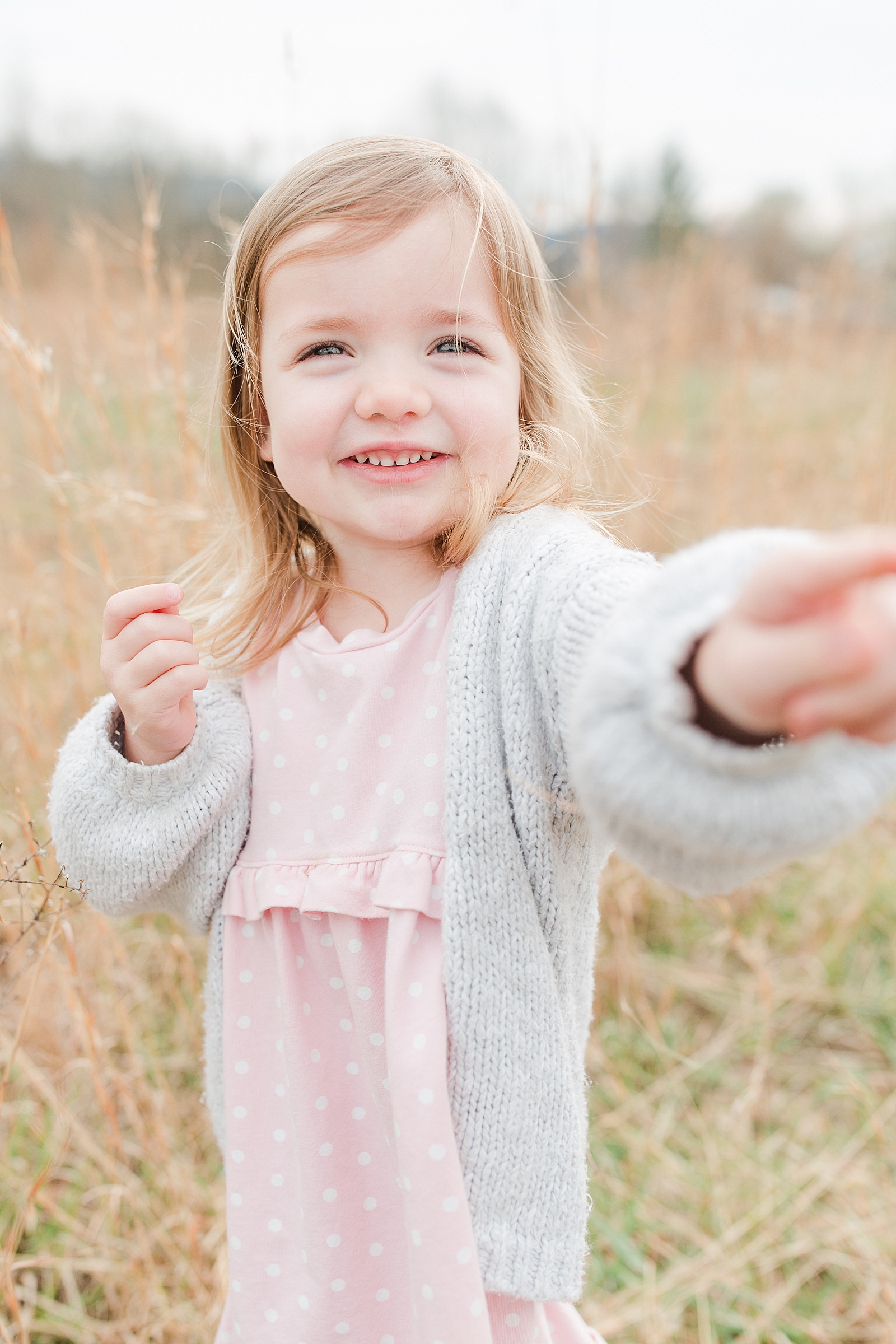 Asheville Photographers Family Little Girl reaching for the camera smiling Photo