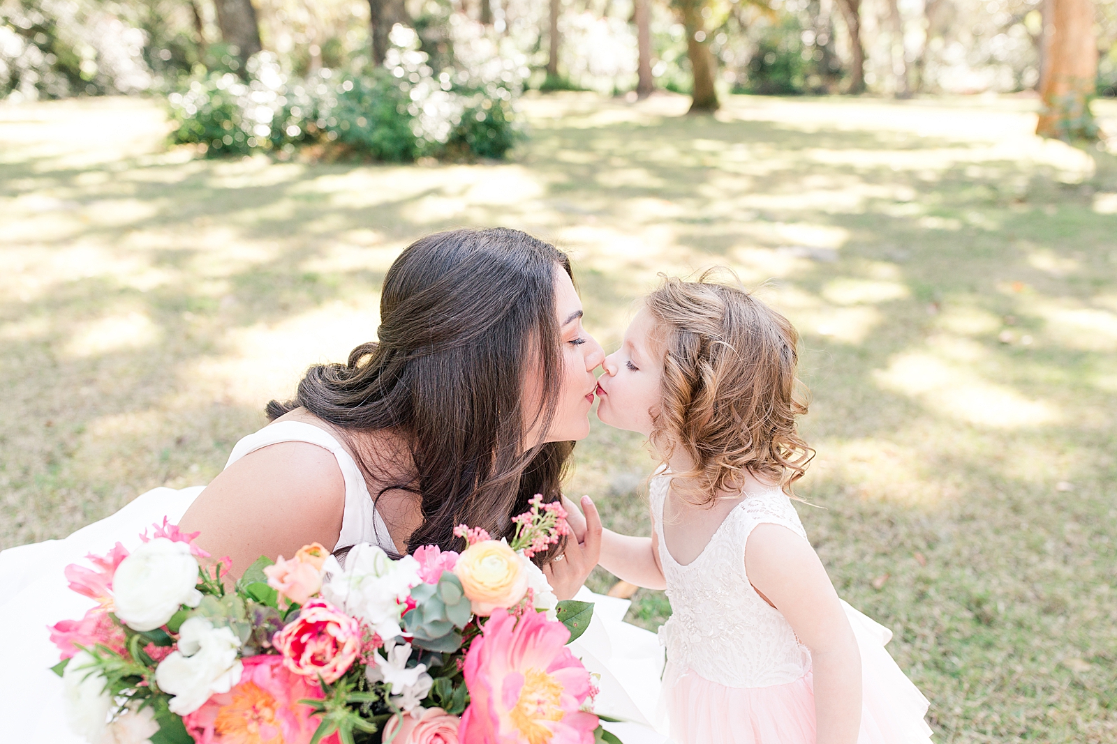 Enchanted Oaks Jacksonville Wedding Bride kissing flower girl Photo