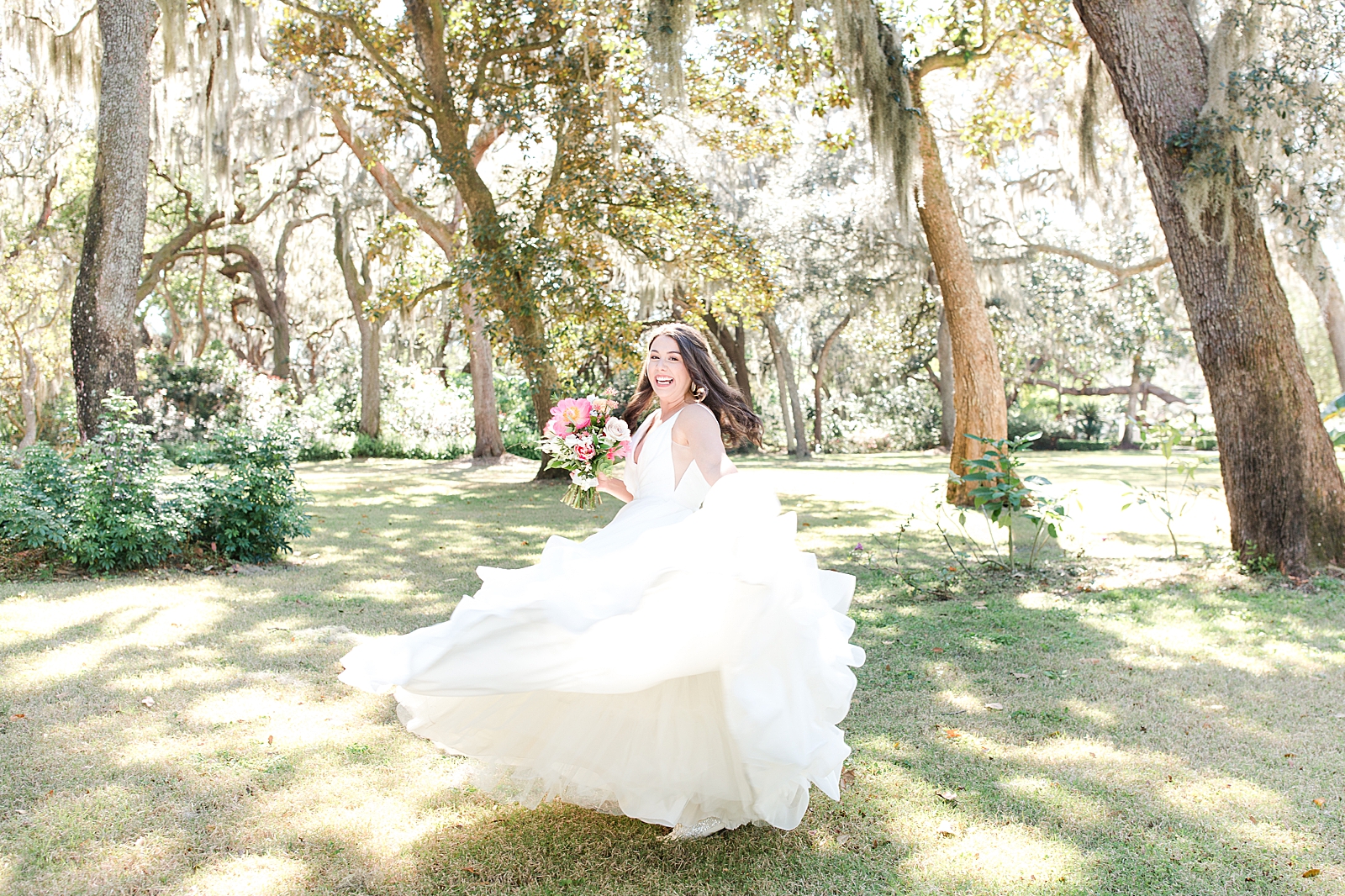Enchanted Oaks Jacksonville Wedding Bride Spinning in her dress smiling big Photo